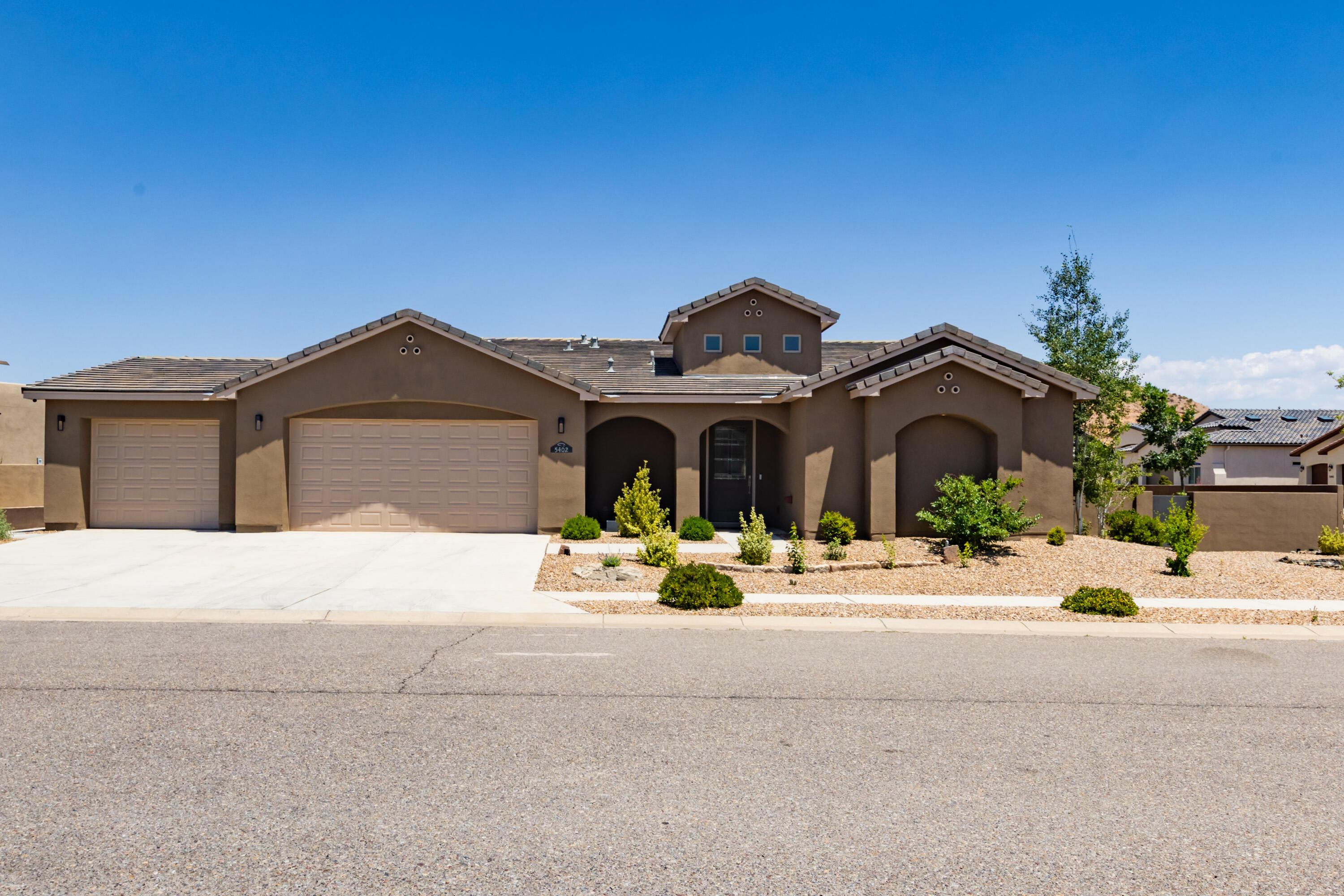 Home design offers Sleek Sophistication Located in Mariposa Secured Gated Community, Generous Corner Lot, w/4 Bedrooms, 3 Bathrooms, Smart Features, Chic Embellishments-Granite Countertops, Italian Marble Backsplash, Crystal Chandelier, SS Appliances, Dual Ovens, Pantry, Fireplace, Electron Blinds, TV's, UV Air Filtration System, Nest Thermostat & Smoke/C02 Detectors,Google Sec. Cameras & Ring. Lavish Landscaping & Outdoor area, Spacious Covered Patio-Dual 12 Ft. Sliders w/New Shades & Remote, Grill, Lavender, Roses, Rosemary, Yucca, & Aspen Trees. Finished Oversized 3 Car Garage w/EV Charging Station, Nov. 2024 New Tankless W-Heater & W-Softener. Quick access to Indoor/Outdoor Pool, Fitness Facility, & Endless Walking/Hiking Trails. Minutes to Unser, 550, I-25, & RR Event Center.