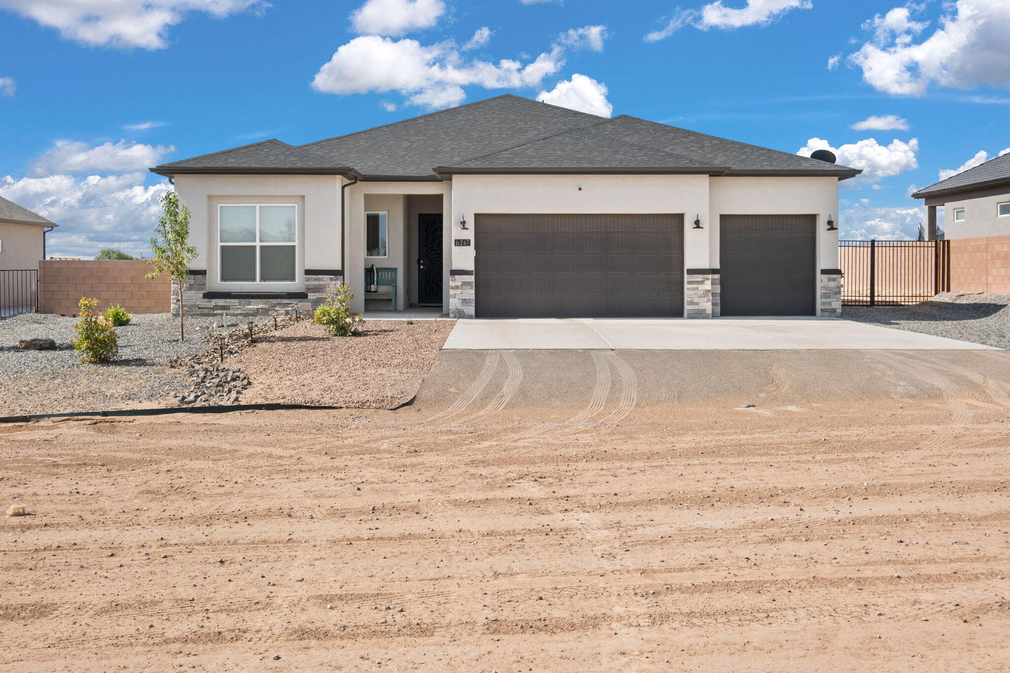 Spacious and thoughtfully designed 4-bed, 3-bath home with backyard access, a 3-car garage, and no HOA! The inviting living room features a stunning custom fireplace and flows into an open-concept kitchen with stainless steel appliances and a huge walk-in pantry. The large primary suite is set apart from the other bedrooms for added privacy, and includes direct access to the laundry room through the walk-in closet--smart and convenient! Step into the backyard and take in the breathtaking views of the Sandia Mountains, offering a picture-perfect backdrop for relaxing or entertaining. With generous living space, quality finishes, and functional design throughout, this home is ready to impress.