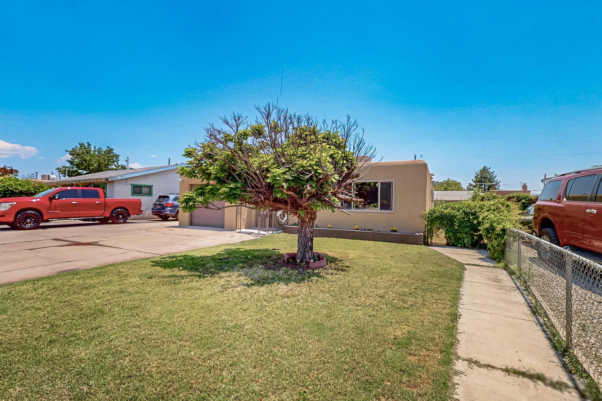 This beautifully updated home features brand new vinyl flooring and energy efficient thermal double-pane windows throughout. The fully renovated bathrooms and kitchen shine with contemporary finishes, including sleek granite countertops, a new microwave, and a convenient washer/dryer combo. The spacious master bedroom boasts a walk-in closet complete with a built-in floor safe for added peace of mind. Enjoy the flexibility of two separate living areas, perfect for entertaining, a home office, or a playroom. Outside, you'll find a versatile workshop and additional storage sheds, providing ample space for tools, hobbies, or extra storage. With a recently updated roof and stucco, this home blends modern comfort with lasting quality. Don't miss your chance to own this move-in ready gem!