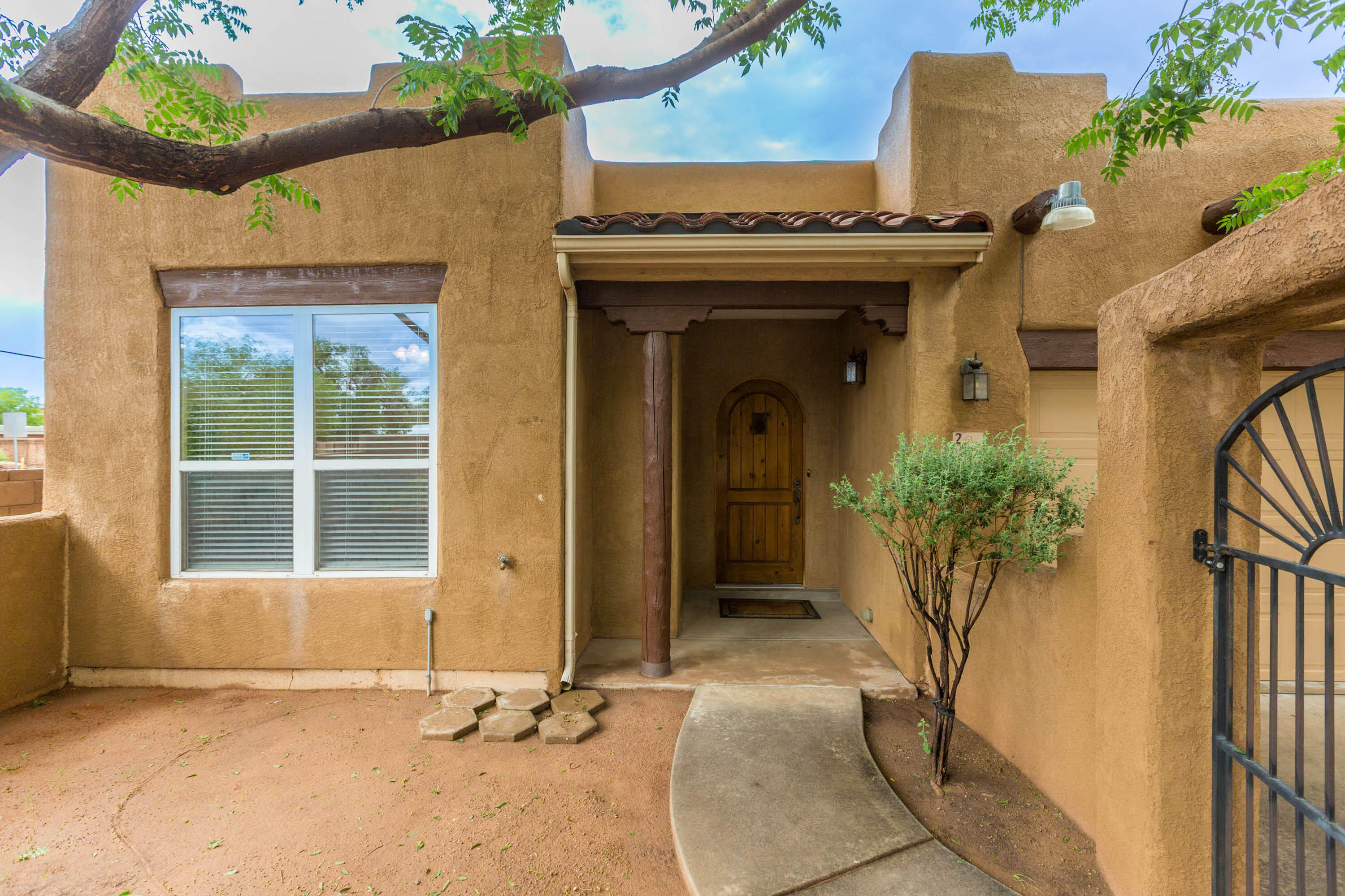 Charming Pueblo-style home in sought after Symphony offers comfortable, single-level living in a peaceful neighborhood. Featuring 3 bedrooms and 2 bathrooms, the layout is both functional and spacious. Bright, open living areas are filled with natural light, showcasing the warm, earthy tones that define the Pueblo style. Kitchen is equipped with modern appliances and ample counter space, ideal for preparing meals and entertaining guests. Master bedroom includes an en-suite bathroom for added privacy. Desirable corner lot, offering extra privacy and outdoor space. Large, grass backyard is fully enclosed with a gated wall, providing a secure and peaceful retreat for relaxation, pets, or outdoor activities. Roof recoated in February 2025 - Details in listing docs.