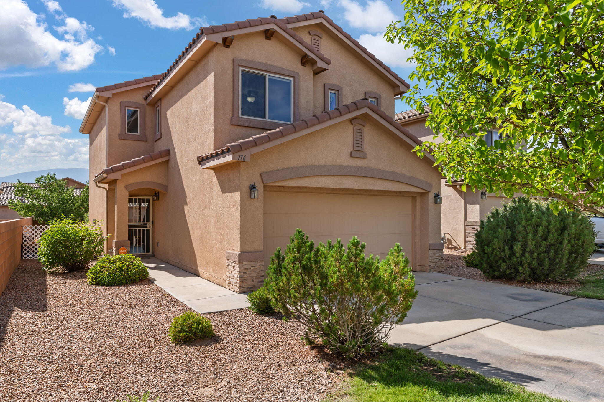 Beautiful home in the sought-after Aldea at Bernalillo, just minutes from The Block in Rio Rancho! Enjoy Sandia Mountain views from two bedrooms and the backyard. Open floorplan connects the living, dining, and kitchen areas--perfect for entertaining. Features include engineered hardwood and tile downstairs, 2020 kitchen updates, and all appliances (including 2019-2020 washer/dryer) convey. Spacious primary suite with walk-in closet. Refrigerated air for year-round comfort. HOA covers front landscaping and common areas. Close to Hwy 550, 528, I-25, shopping, restaurants, and more. Don't miss this one! Homes like this don't last--schedule your showing today!