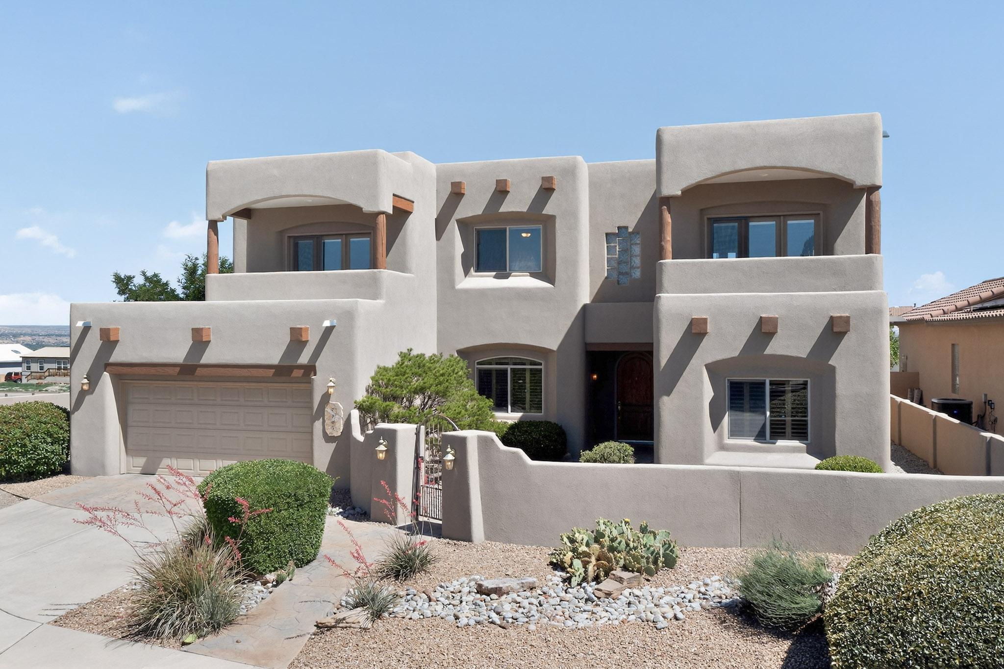 Welcome to your private oasis in the prestigious gated community of the Estates of Desert Ridge. This exceptional home is perfectly situated at the end of a quiet cul-de-sac, offering unmatched privacy and stunning panoramic views of the Sandia Mountains. Enjoy front-row seats to the dazzling Balloon Fiesta and seasonal fireworks from the comfort of your own backyard or one of three private balconies--including a spacious one off the primary suite. The resort-style backyard features a sparkling pool with a custom rock water feature, ideal for relaxing or entertaining. Efficient living is a breeze with paid solar panels that help keep electric bills low. This is truly a rare opportunity to own a home that combines luxury and comfort in one of Albuquerque's most sought after communities.