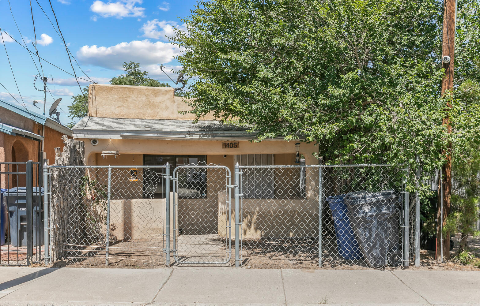 This cozy two bedroom one bathroom Home is located downtown in the Barelas neighborhood. This Home has a lot of updates large bathroom & nice size bedrooms. The open floor plan has plenty of room for entertaining & chilling. The Home stays nice & cool with the large master cool that was installed two years ago. The updated kitchen is perfect for cooking your favorite meals. The large backyard is great for storage, games, pets or just enjoying the 300 days of sunshine here in New Mexico. You can enjoy the dancing downtown and then walking  or taking a Lyft back Home in a short amount of time. Come live the tranquil life in downtown Albuquerque.