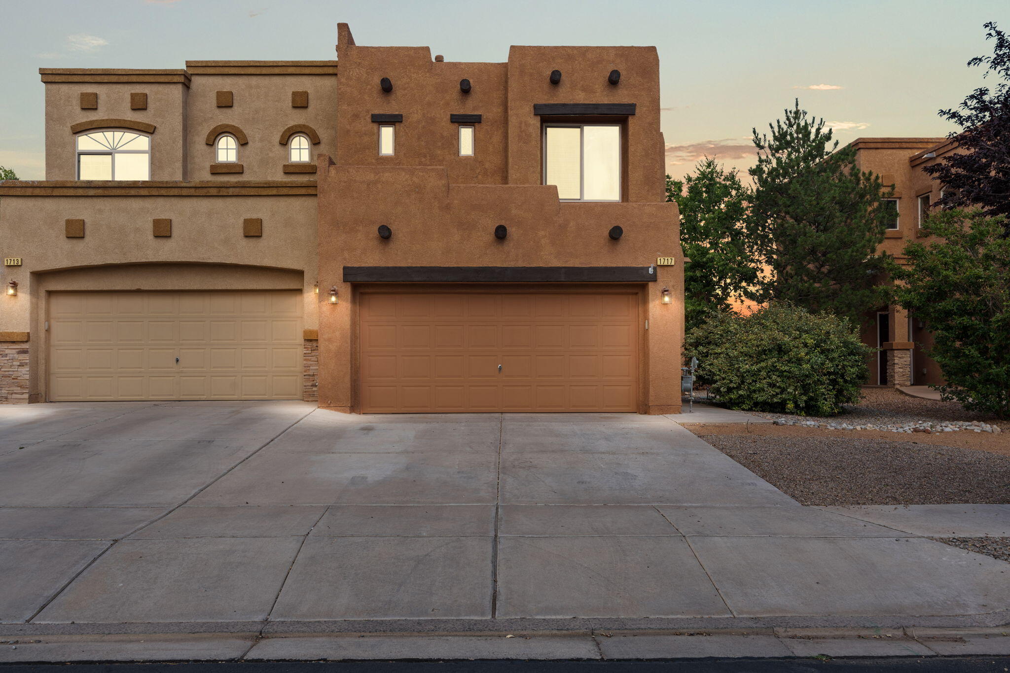 Discover comfort and charm in this inviting Pueblo-style townhome, nestled within the gated Astante community of Rio Rancho. Designed with a warm, cozy atmosphere, the home features a bright open floorplan, perfect for both everyday living and entertaining. The living room offers a fireplace and built-in entertainment center, while the kitchen includes appliances, a pantry, recessed lighting, and counter seating for casual meals. All bedrooms are upstairs, including a spacious primary suite with a full en-suite bath and walk-in closet. Outside, enjoy a 2-car garage, landscaped front and back yards, and a walled backyard for added privacy. Just a short walk to community amenities including a pool, scenic trails, and neighborhood parks, making it the perfect place to call home.