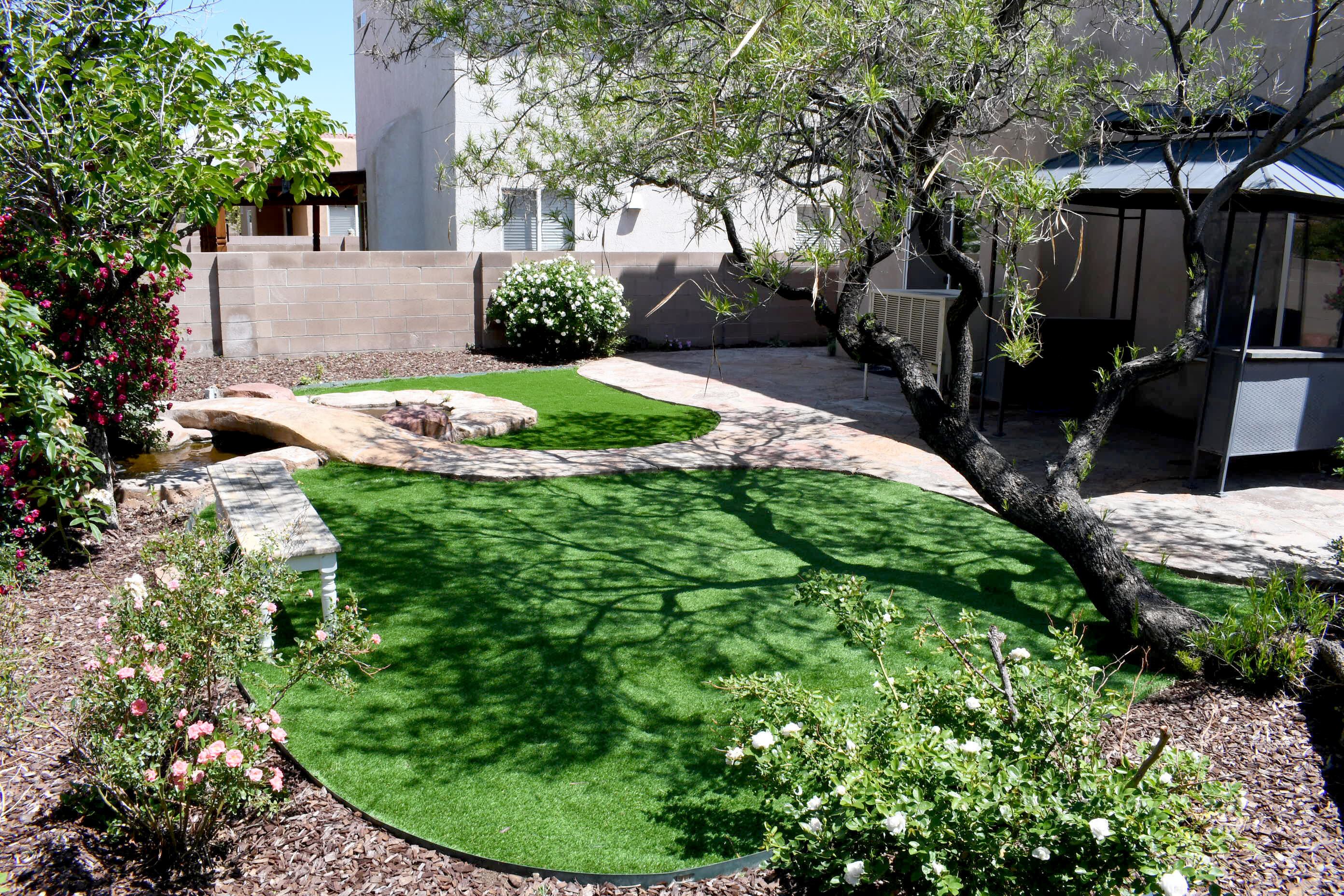 PRIVACY and SERENITY in your own backyard along with a PERFECT MOVE IN READY home with gleaming floors (no carpet), fresh paint, Quartz kitchen counters, gas range, and half bath downstairs. 3 spacious bedrooms upstairs with great separation, plus 2 full baths, and laundry service room. Primary Br has walk in closet & mtn views. As part of the Vista del Norte planned community enjoy a walking, jogging trail system, and parks dotted throughout the area for relaxation, play & sporting events. This central location means quick access to a Rail Runner station, Paseo Del Norte, the Big I, downtown, Sunport, services, restaurants and award-winning schools. In Photos, click on Top Right Heading, Virtual Tour, Click on View Tour for a quick description. See it TODAY!