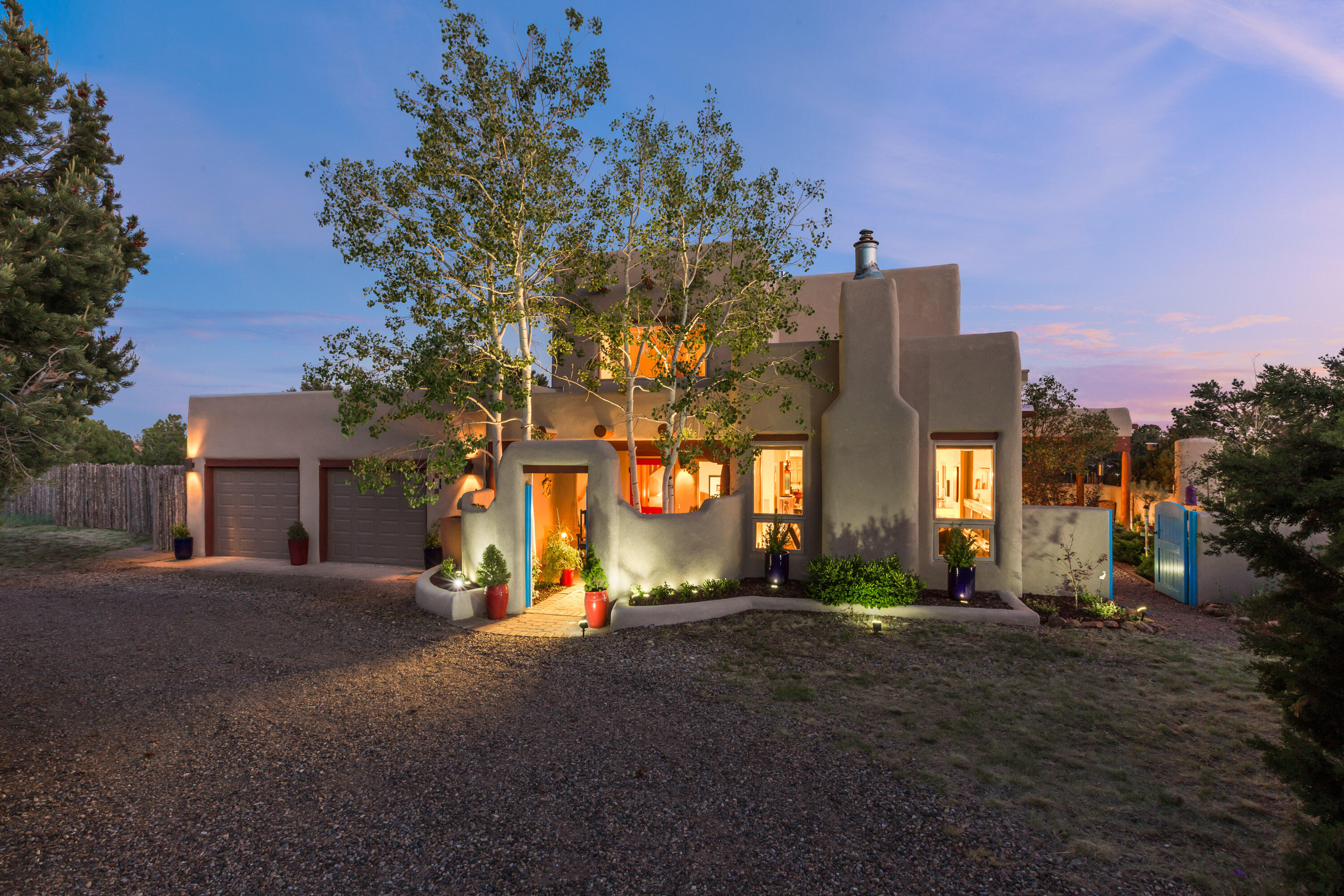 Beautiful night skies, mountain vistas, & serene peaceful courtyards await you in this stunning mountain home.  Recent stucco, quality thermal windows, and TPO roof add to the mix!!  View your own Aspen & huge NM skies from the large windows. Charming courtyard leads to elegant entry w/stone tile floors & 2 story ceiling. Vigas! Living rm with 3/4'' hardwood flrs, picture window framing backside of Sandias, & cozy pellet stove. Formal dining w/nichos. Kitchen w/granite counters, pantry, & stainless appliances is open to den w/kiva frplc & patio dr to courtyard w/frplc. 3 bdrms on main level, & 2.5 baths. Upstairs find loft and generous primary bedroom views, frplc, spacious walk-in closet & great bath w/tub, sep shower & double sinks. Oversized 2 car garage.  Community water. Special home!