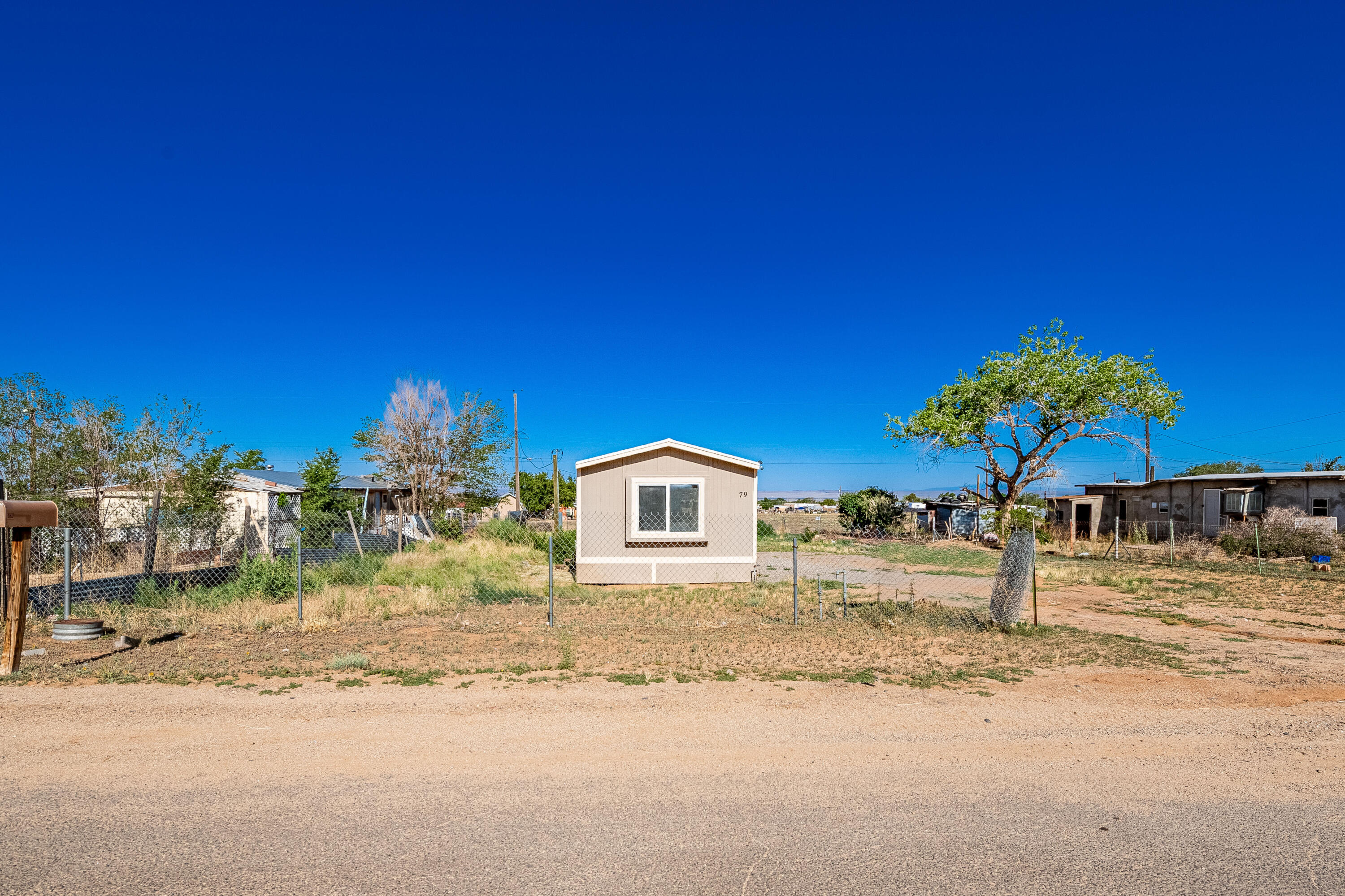 Welcome to this beautifully updated 3-bedroom, 2-bathroom mobile home nestled on a generous 0.27-acre lot in the heart of Los Lunas, NM. With 980 sq. ft. of thoughtfully designed living space, this home offers comfort, functionality, and modern upgrades throughout.Step inside to discover a bright, open layout featuring fresh paint, updated flooring, and stylish finishes. The kitchen has been remodeled with new cabinetry, countertops, and appliances, making it the perfect space for cooking and gathering. Outside, enjoy the freedom of a large, fully usable lot--ideal for gardening, pets, or future additions. Whether you're looking for your first home, a rental property, or a place to downsize,this move-in ready home offers value and versatility in a peaceful neighborhood just min