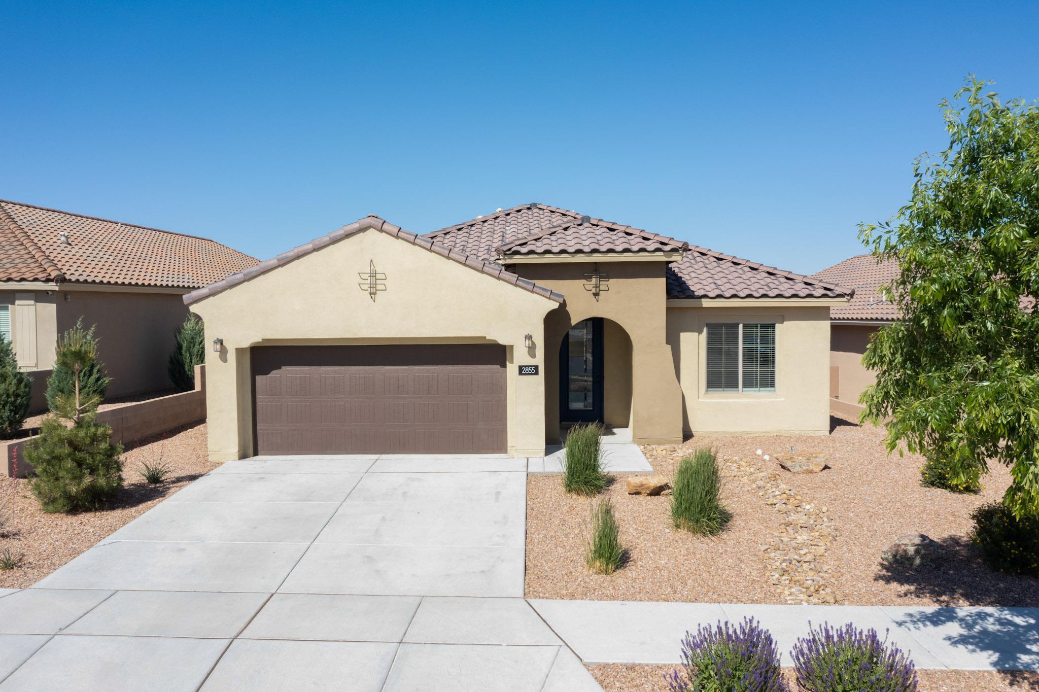 This beautiful, move-in ready Mariposa home is a stunning balance of NM charm and contemporary beauty.  Nestled in a gated community with unparalleled NM desert views, this home seamlessly showcases everything Mariposa has to offer!!   Upon entry, you'll immediately notice the beautifully staggered tile throughout the home and all wet areas.  The office off the front entry provides plenty of office or play space.  The smart kitchen offers SS appliances, drop lighting, granite countertops, staggered cabinetry and a gas cooktop.  All carpet in the home is brand new! The mudroom offers ample space for everyone in the house (especially the furry ones!).  A custom dog run, gas fireplace and sandbox can all be simultaneously enjoyed in this incredibly backyard with views that never end