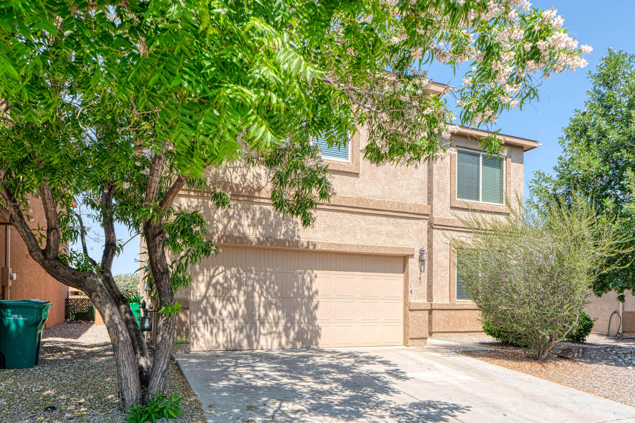 Spacious 4-bed, 2.5-bath DR Horton home with two living areas plus a versatile loft. The main level features a formal dining room, den, and an open-concept family room that flows into the kitchen. The kitchen includes stainless steel appliances, a 5-burner gas range, a corner pantry, island with bar seating, reverse osmosis, and a deep sink with a backyard view. A half bath with pedestal sink and smart under-stair storage. French doors open to covered patio and low-maintenance, rock-landscaped yard. Upstairs, the private primary suite offers a garden tub, double sinks, walk-in closet, and separate water closet. The laundry area is also conveniently on the upper level. Fresh carpet installed Nov. 2024. HOA maintains front yard! Parks and trails nearby. Santa Fe and KAFB both under an hour.