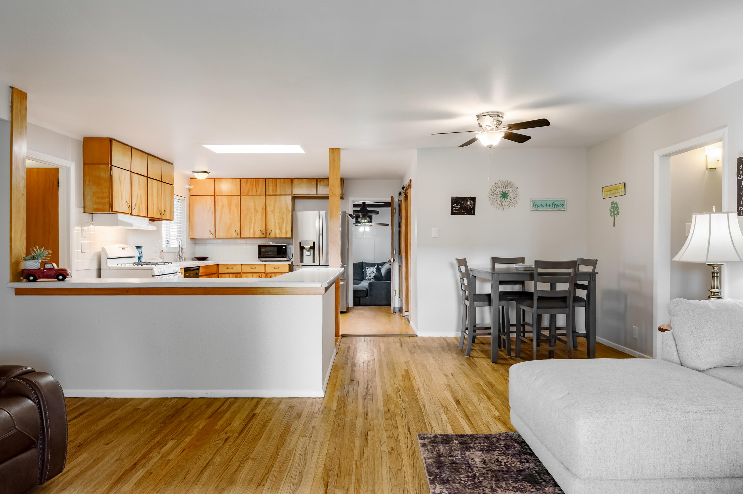 Wow!  This updated home offers so much!        5 Bedrooms and 1 full and two 3/4 baths.  One bath is Fully handicap accessible bathroom  All baths are updated.  In the center of home is a Bright Beautiful open kitchen with skylight, gas stove and recent refrigerator.  Kitchen opens to living room.  Large den with fireplace and access to rear enclosed porch.  Bedrooms are separated with two on one side of the home and three on the other.  Primary bedroom with en-suite bathroom and the bath has a heated floor!     Thermal windows.  Vinyl plank flooring.  Recent MASTER COOL,   RV  pad with 5 amp hook up.