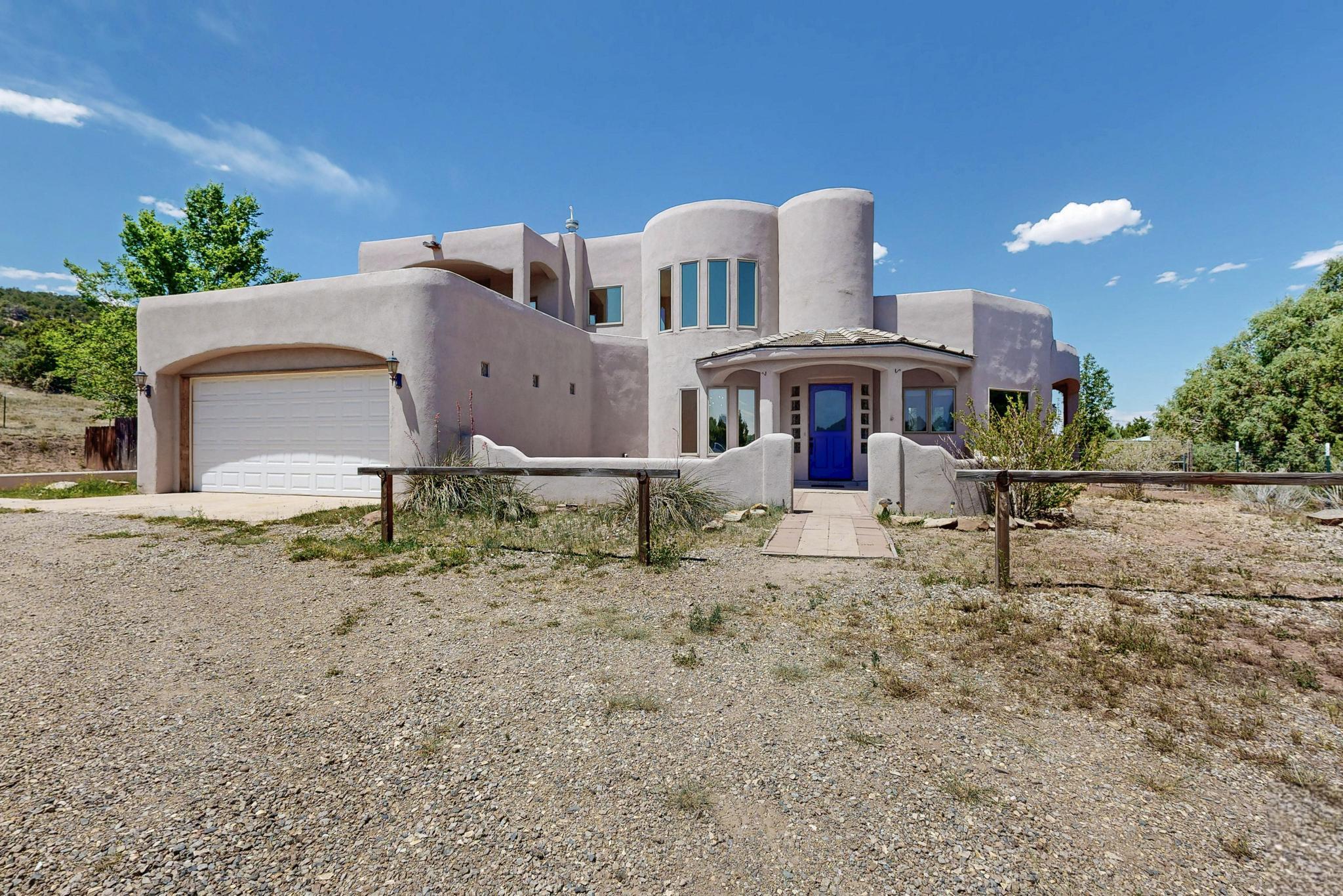 Unique custom home with so much you'll love! Located at the end of a cul-de-sac in a quiet friendly neighborhood. Excellent floor plan has a spacious living room with a kiva fireplace and soaring ceilings. Cozy modern kitchen with breakfast nook and pantry. Luxurious owner suite on main level. Spa-like guest suite on second level. Generous back yard with room for pets and kids to play or start a garden. Updated systems include newer evaporative cooler, newer radiant floor heating boiler/on-demand hot water heater, and water softener. New stucco in process. Tons of home improvements and upgrades done to add comfort and many loving touches! See attached list of improvements by current owners. Private well, propane and septic. Don't miss this beauty!