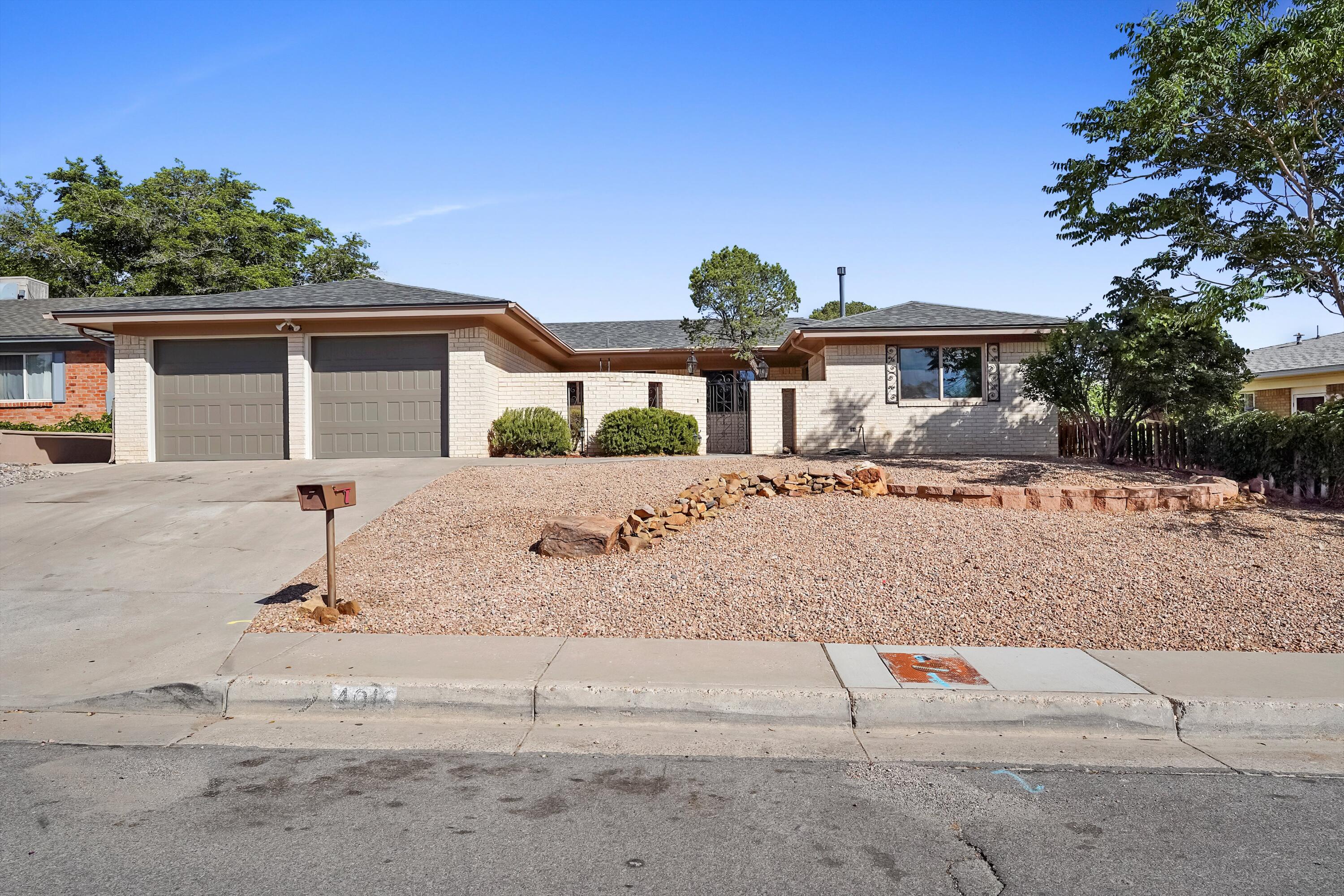 Welcome to this beautifully renovated home in a great NE Heights location.  Updates include all new LVP flooring throughout, fresh paint, kitchen updates including granite counters, stainless appliances, undermount sink & tile backsplash.  You'll love the modern bath updates too.  Brand new roof with warranty, new garage doors with openers, new HVAC with refrigerated AC!  Relax in the sparkling pool which was just repainted and features brand new pool equipment as well.  Covered patio, views of the Sandias, you'll want to spend all your time outside.  One side of the garage is 23' long, perfect for those with a large truck.  Super location, close to great schools, shopping and dining.  Come see this move in ready home today.