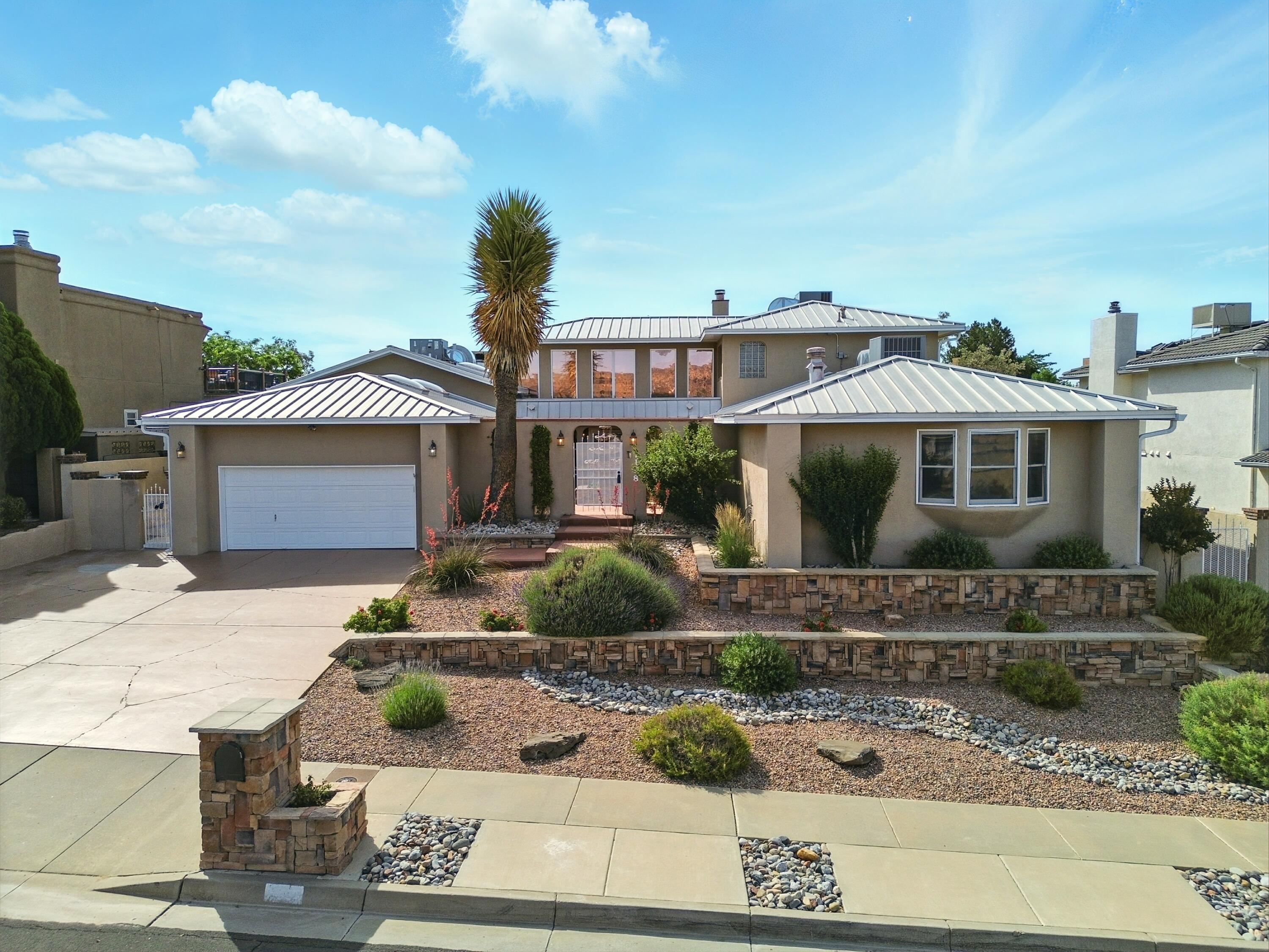 Nestled in the desirable Taylor Ranch community, this stunning 4 bed/4 bath custom home offers comfort, style & space to entertain. Enter into ''La Sala Grande'' featuring 12' ceilings/diamond plaster walls/recessed lighting/stacked-stone wood-burning fireplace. The chef's kitchen boasts stainless steel appliances/double oven/granite countertops/oak cabinets/island range with both bar seating & dining area. Upstairs, the private primary suite is a retreat with its own fireplace/balcony/walk-in closet/jetted tub/oversized shower. The landing area is perfect for a home office or workout nook. Downstairs, two guest rooms offer ensuite baths.  The landscaped backyard includes a covered portal/heated pool w/electric cover/hot tub/fire pit/bar/built-in speaker system for ultimate enjoyment.