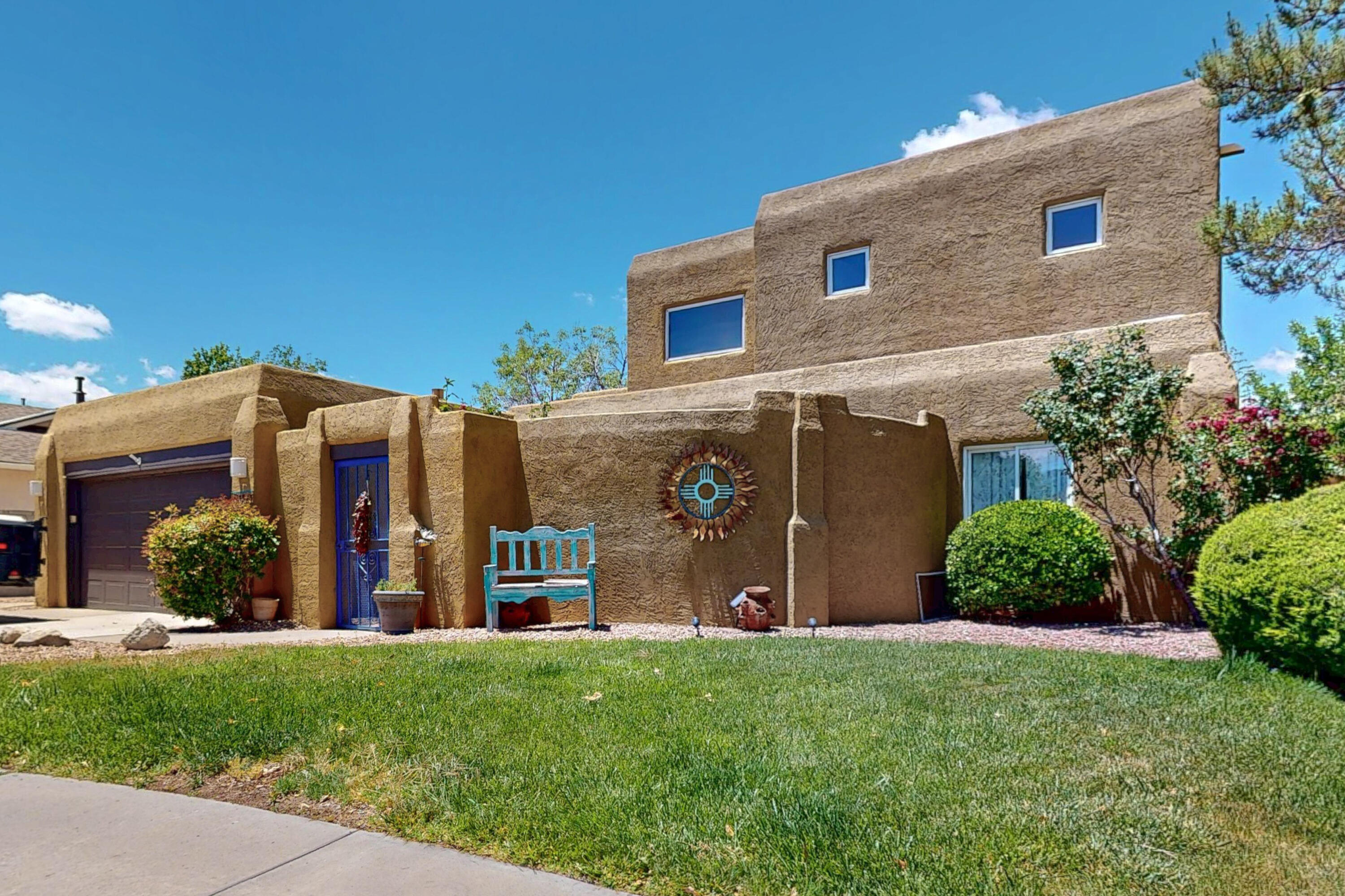 Discover this beautiful southwest home that perfectly blends comfort and style, offering an abundance of natural light and an inviting open floorplan.  Primary bedroom retreat is located upstairs and features a private balcony to enjoy stunning sunset views.  A cozy sitting area adds extra comfort and space.  Guest accommodations include two thoughtfully designed bedrooms located on the main floor offering convenience and privacy.  the beautifully crafted walk-in shower adds a touch of luxury.  Stay cool in the hot Albuquerque summers with refrigerated air conditioning. Benefit from a new TPO roof installed in June 2025 and fresh interior paint completed May 2025, ensuring peace of mind and modern aesthetic.