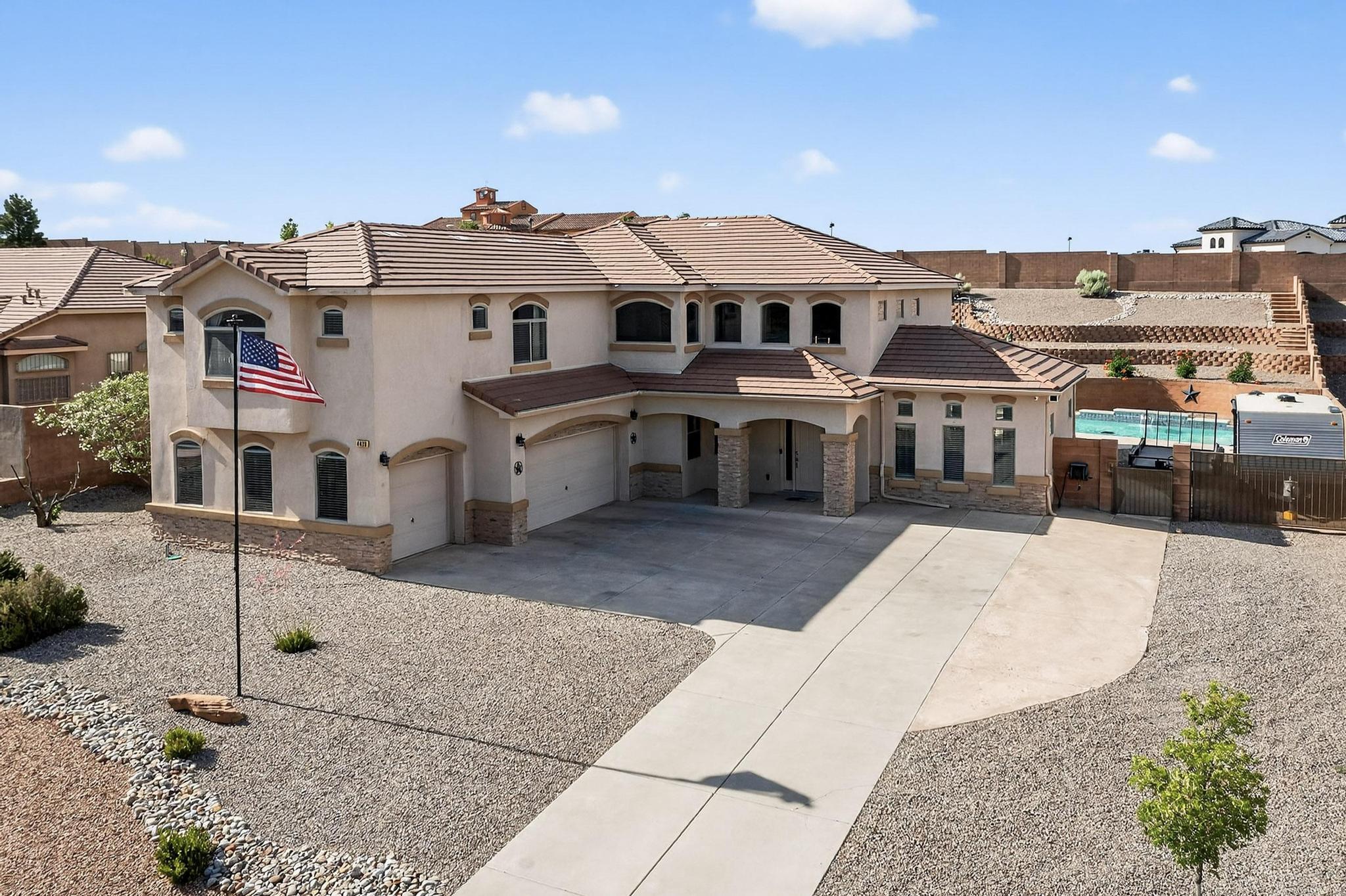 Luxurious 5-bedroom home in popular Diamond Ridge, blending modern design with ultimate comfort. Built by D.R. Horton, the open floor plan offers seamless flow through spacious living areas. The chef's kitchen features granite countertops, custom cabinets, and a large island. Enjoy a game room and a generous loft--ideal as a second living area. Step outside to your private retreat with a sparkling POOL and low-maintenance synthetic turf landscaping. Views of the Sandia Mountains from the backyard or Primary Balcony!! Every detail is crafted for style, function, and relaxation. New Tuff Shed just installed in May 2025, perfect for a Workshop!!