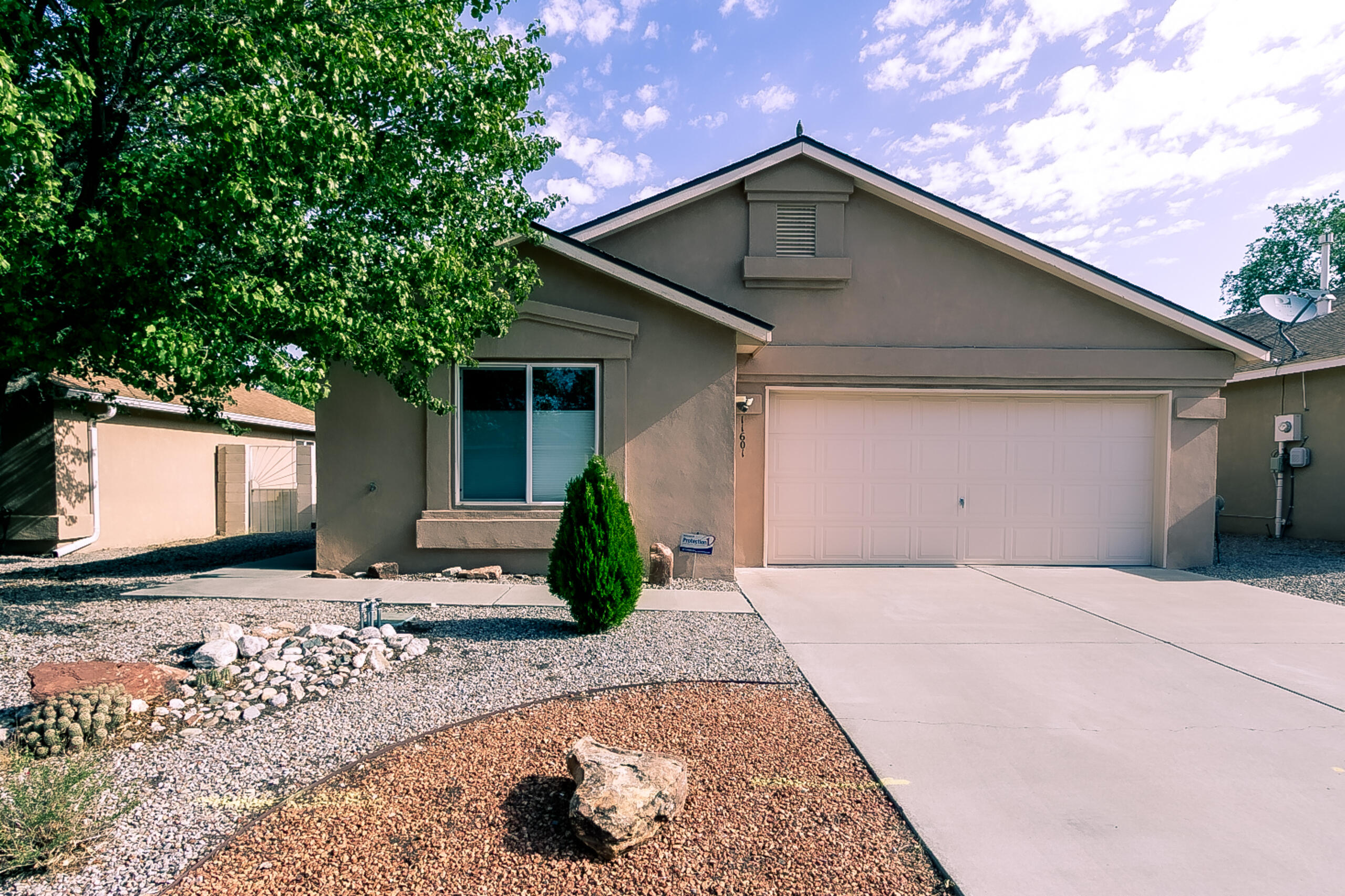 Beautifully maintained home w/ an open floor plan, updated lighting fixtures & custom tile flooring throughout (carpet only in bedrooms). The kitchen is a standout w/ granite countertops, a large island w/ breakfast bar, stainless steel appliances, custom tile backsplash, recessed stainless steel sink, & under-cabinet lighting. Addit features incl, 2 pantries, & a built-in desk area w/ granite countertops & glass upper cabinet doors. Lower cabinets have convenient rollouts for storage access. The spacious owner's suite incls a walk-in closet w/ custom rods, drawers, & open shelving. The en-suite bath features a walk-in shower w/ updated surround w/glass doors, solid surface vanity w/ recessed sink, updated plumbing & lighting fixtures, & custom tile flooring.