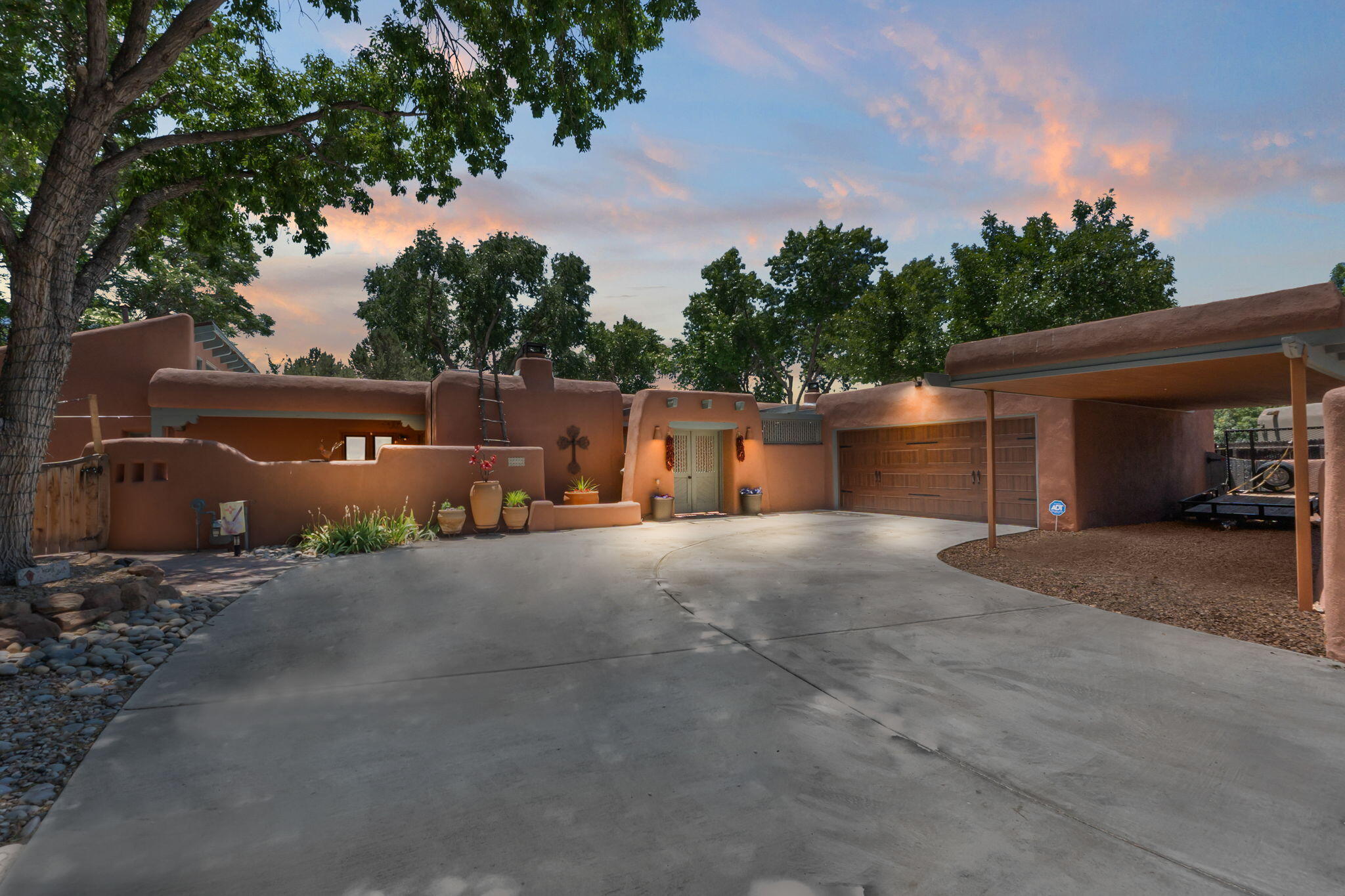 Quintessential North Valley Charmer, a true New Mexico masterpiece  nestled on a quiet cul de sac ( ..42 acre lot) in the highly sought after neighborhood of Dietz Farms. Home boasts adobe accents, brick floors, Beams T & G ceilings, 5 custom Kiva fireplaces,  ( 3 gas, 2 wood burning)  talavera accents.   Formal living room or library w/ built in bookshelves & Kiva. So many additional living area options w/great open spaces for entertaining, bar area, etc.  Eat- in nook or dining w/ banco seating & kiva.  Spacious Primary w/ huge custom walk in closet & fireplace.   Original SW features & refined modern touches. Updated Baths.  Backyard outdoor living & entertainment area is a DREAM complete w/ Inground heated Pool, lush lawn, seating areas,   garden area, complete w/ walled privacy
