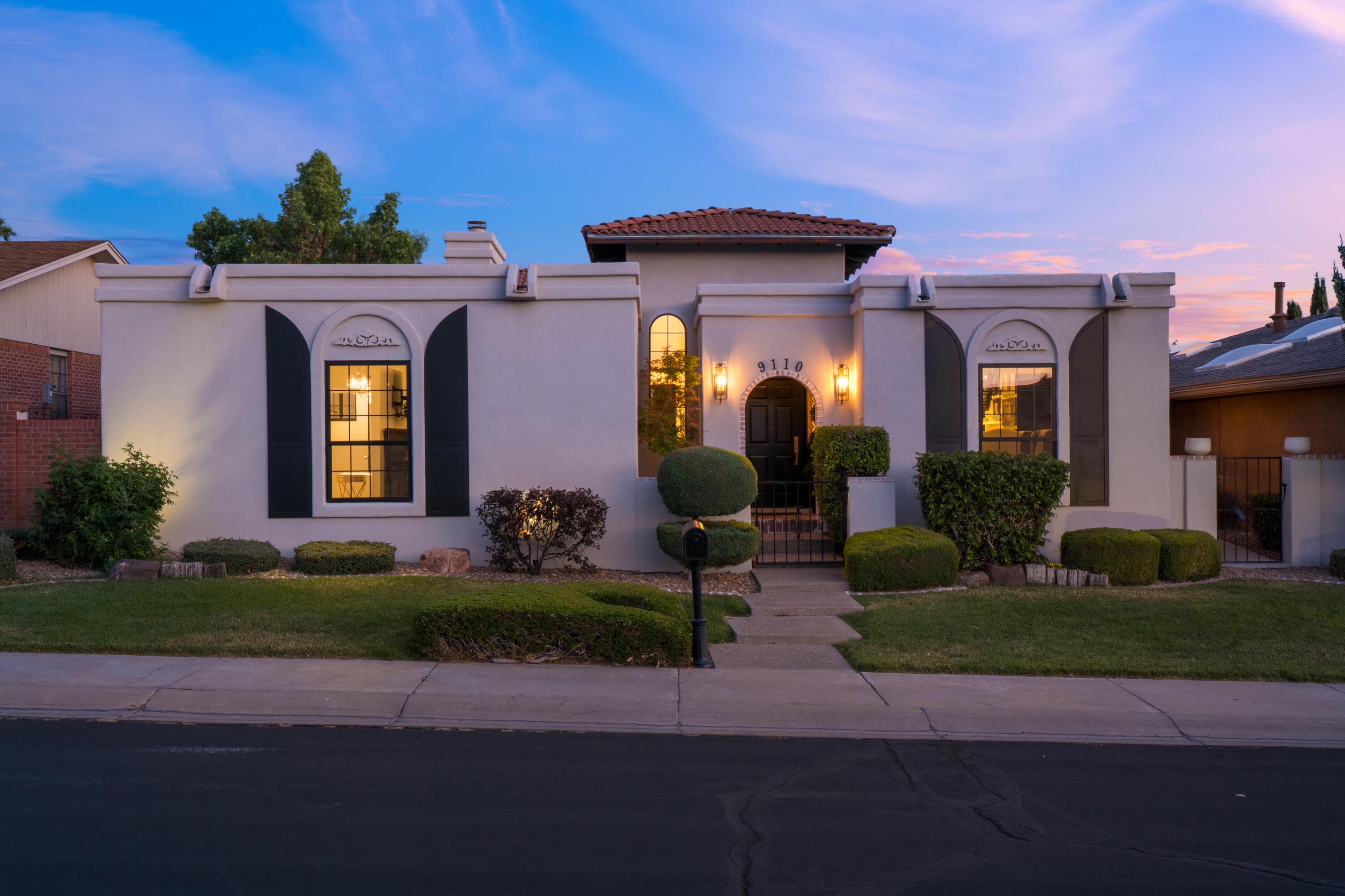 Exquisitely Designed & Fully Remodeled Tanoan West Stunner! Step into refined luxury in this beautifully renovated home located in the prestigious gated community of Tanoan West. Every inch of this residence has been professionally designed and thoughtfully updated to offer both elegance and comfort. The bright and open floor plan features rich wood flooring, custom cabinetry, & an effortless flow ideal for both everyday living and entertaining.Enjoy evenings under the stars in your private outdoor dining space--perfect for dinner parties. Most recent upgrades include Milgard Windows, a new tankless water heater, and more, ensuring both style and efficiency throughout. This home is a rare find, combining high-end design with timeless functionality in a great location.