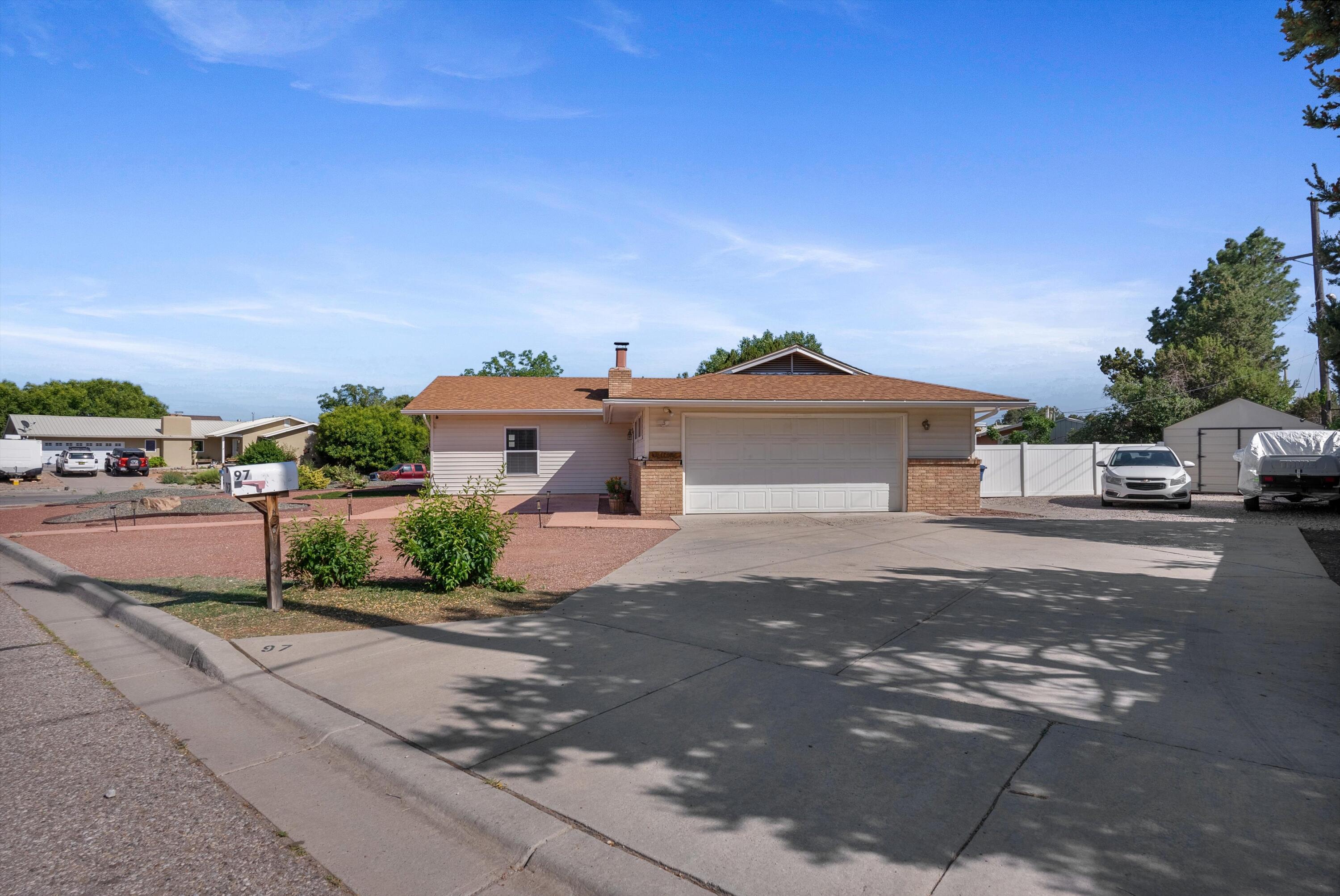 Welcome Home! Adorable corner lot with spacious backyard, 30 amp hookup, hot tub, oversized shed and solar! This charming single story offers a flexible and comfortable layout with 3 bedrooms 2 living areas and a cheerful eat-in kitchen. An additional updated bathroom adds functionality and style to the space. Enjoy the landscaped backyard perfect for relaxing, pets, gardening or entertaining. A standout feature is the oversized shed offering incredible storage, potential for a workshop, or hobby room. 2 car garage and solar system for the cost saver! Solar system is financed. Conveniently located with easy access to local amenities, this well maintained home is ready to welcome its next owner!