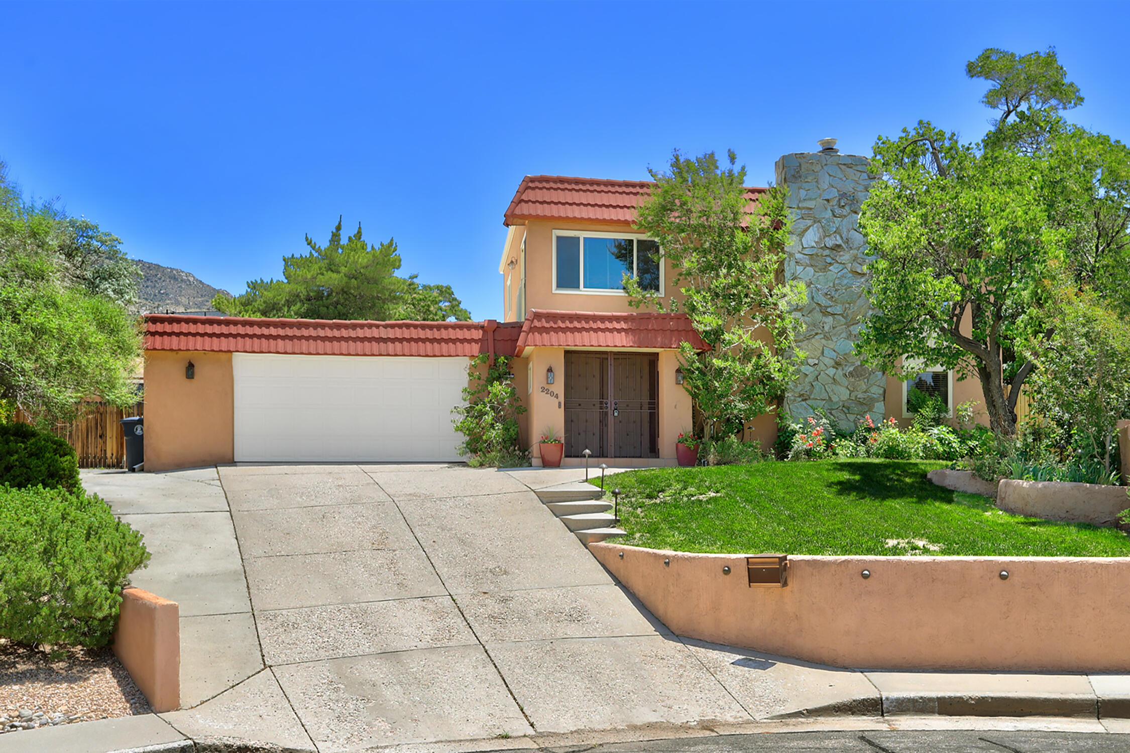 Welcome to your dream home near the Northeast Foothills on a serene cul-de-sac that offers a perfect blend of luxurious comfort and functionality! This stylish residence features a gourmet Tuscan kitchen, complete with plentiful workspace & storage, rich knotty alder cabinets, stunning granite countertops and many additional chef-focused features you have to see in-person. An entertainer's dream layout allows for seamless flow between spaces - great for hosting gatherings or enjoying peaceful evenings. The all-season outdoor living area showcases established lush landscaping, cozy sitting areas, integrated speakers, raised beds, automatic irrigation & lighting. The home has a primary suite on each floor: upper suite has overlooking views & spacious closets, main floor suite has lots of