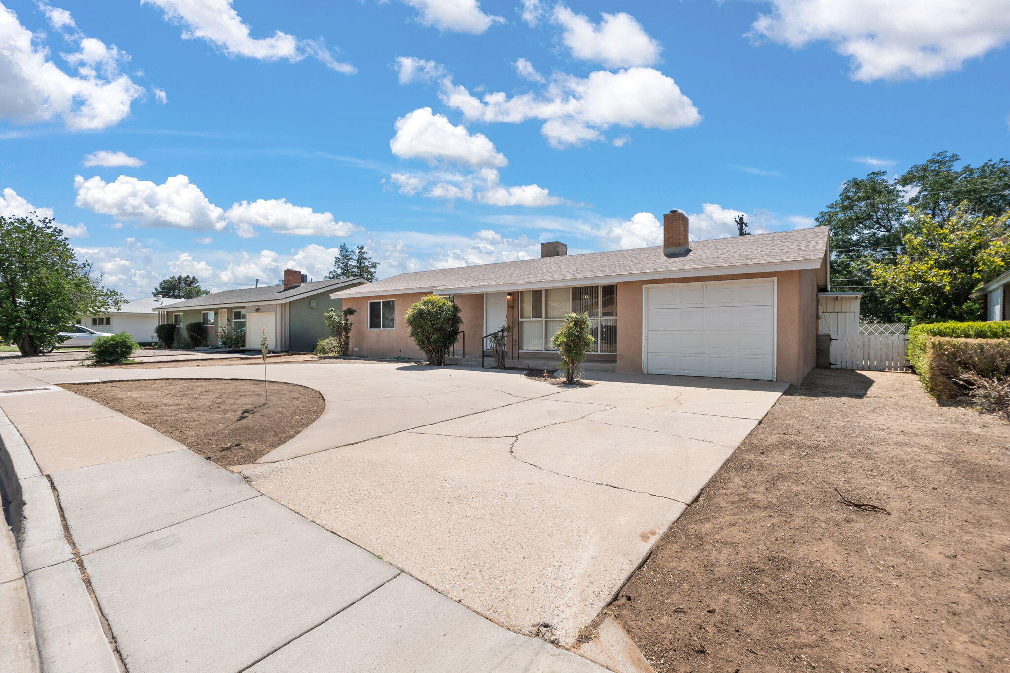 Beautifully Remodeled Mossman Home in the Heart of Albuquerque!This charming home has been lovingly updated and meticulously maintained. Step into a bright, inviting space where both bathrooms have been tastefully remodeled and the kitchen shines with brand-new cabinetry, solid surface countertops, updated fixtures, and modern appliances. Fresh paint throughout the home brings a crisp, clean feel, complemented by new windows, front,  back and side doors, updated stucco, & cozy new carpet in the second living area and office.But that's not all--comfort meets style with a newly installed mini-split system in the second living area, and the original wood floors have been beautifully refinished, adding warmth and character. This is a true move-in ready gem!