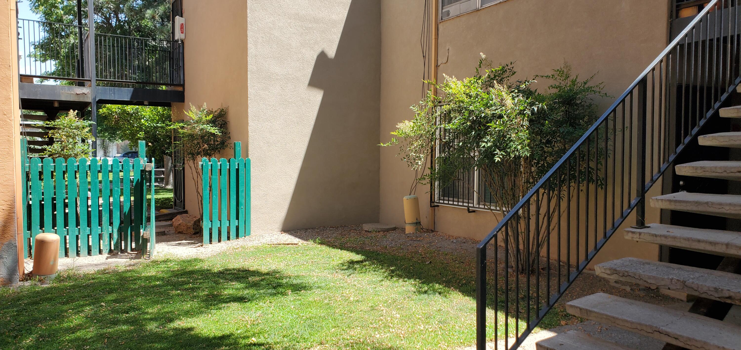 Super cute updated, coveted GROUND FLOOR condo in a superior serene location!  Great orientation off pleasant court yard which adjoins additional courtyard through cute gate.  A truly private oasis.  A rare find.  HOA fee includes ALL UTLITIES! Enjoy the delightful pool with quiet shady area. A lovingly remodeled condo with laminate floors throughout and spacious walk in shower.  Higher End, top of the line, Refrigerated Unit.  Washer/Dryer included!  Well managed, gated community. RUN! Furnishings could be negotiated.