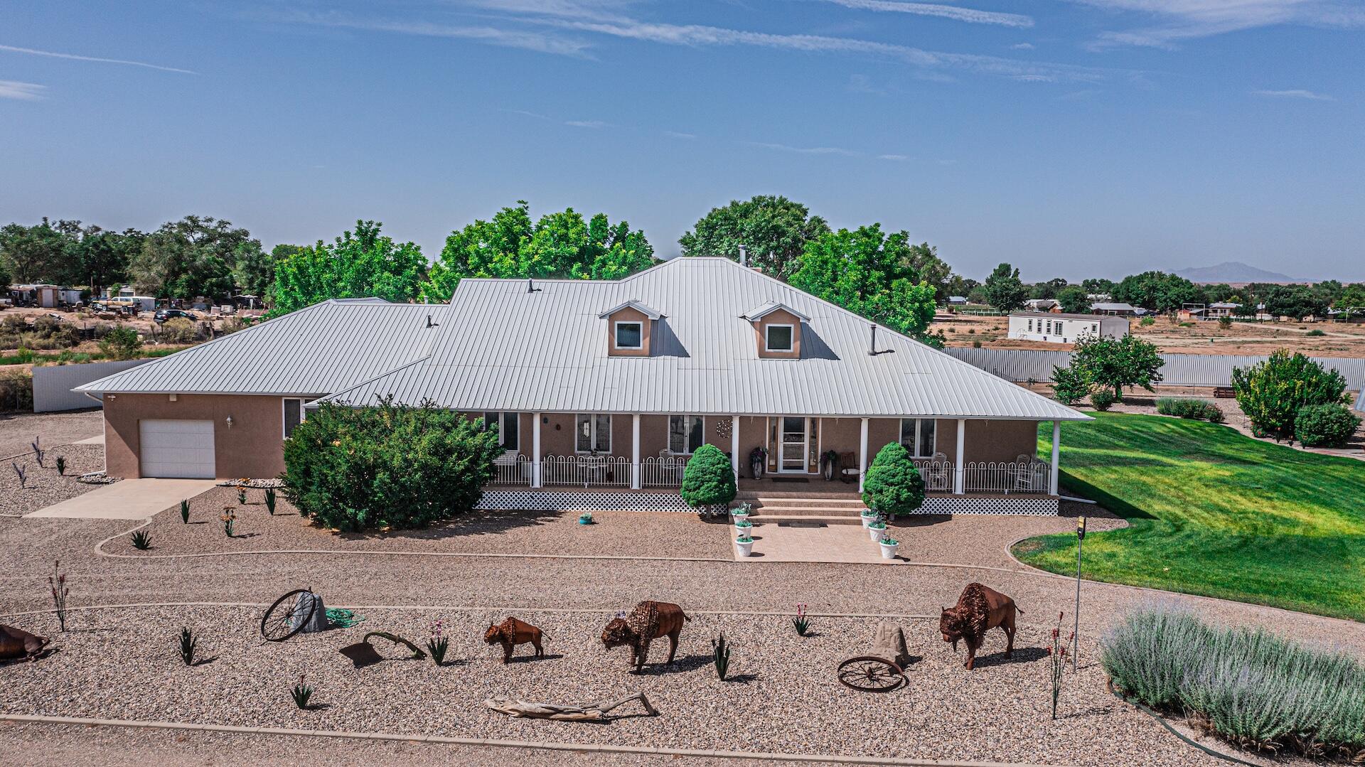 Welcome to this stunning 5-bedroom, 3-bathroom home set on 4 acres of open space! This unique property features two master suites on the main level, including a luxurious main suite with a huge, oversized walk-in closet, dual shower heads, and a cozy pellet stove for added comfort. Enjoy the open-concept kitchen with updated countertops, upgraded windows, a double oven, and a large walk-in pantry--perfect for entertaining or everyday living. The home also includes an oversized 3-car garage.But that's not all--this property also comes with a 3-bed, 2-bath single-wide home, ideal for extended family or rental income, plus an oversized shop and carport for all your storage and parking needs. With space, upgrades, and flexibility, this property has so much to offer--schedule your showing today