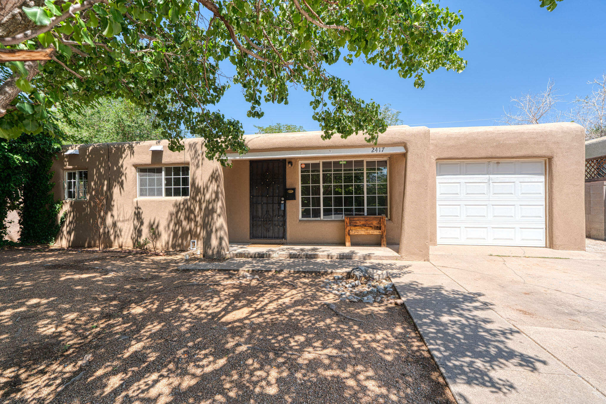 Welcome home to this light-filled 4-bedroom, 2-bath gem in an established neighborhood with mature landscaping and full block-wall privacy. The flexible floor plan features hard surface flooring throughout, fresh paint, thermal pane windows, and a brand-new sewer line. The beautifully updated kitchen offers new cabinets, granite countertops, stainless steel appliances, and a 5-burner gas stove. A separate-entry casita with kitchenette provides the perfect space for guests, in-laws, or a home office. Includes a 1-car garage and is conveniently located near schools, shopping, and more!