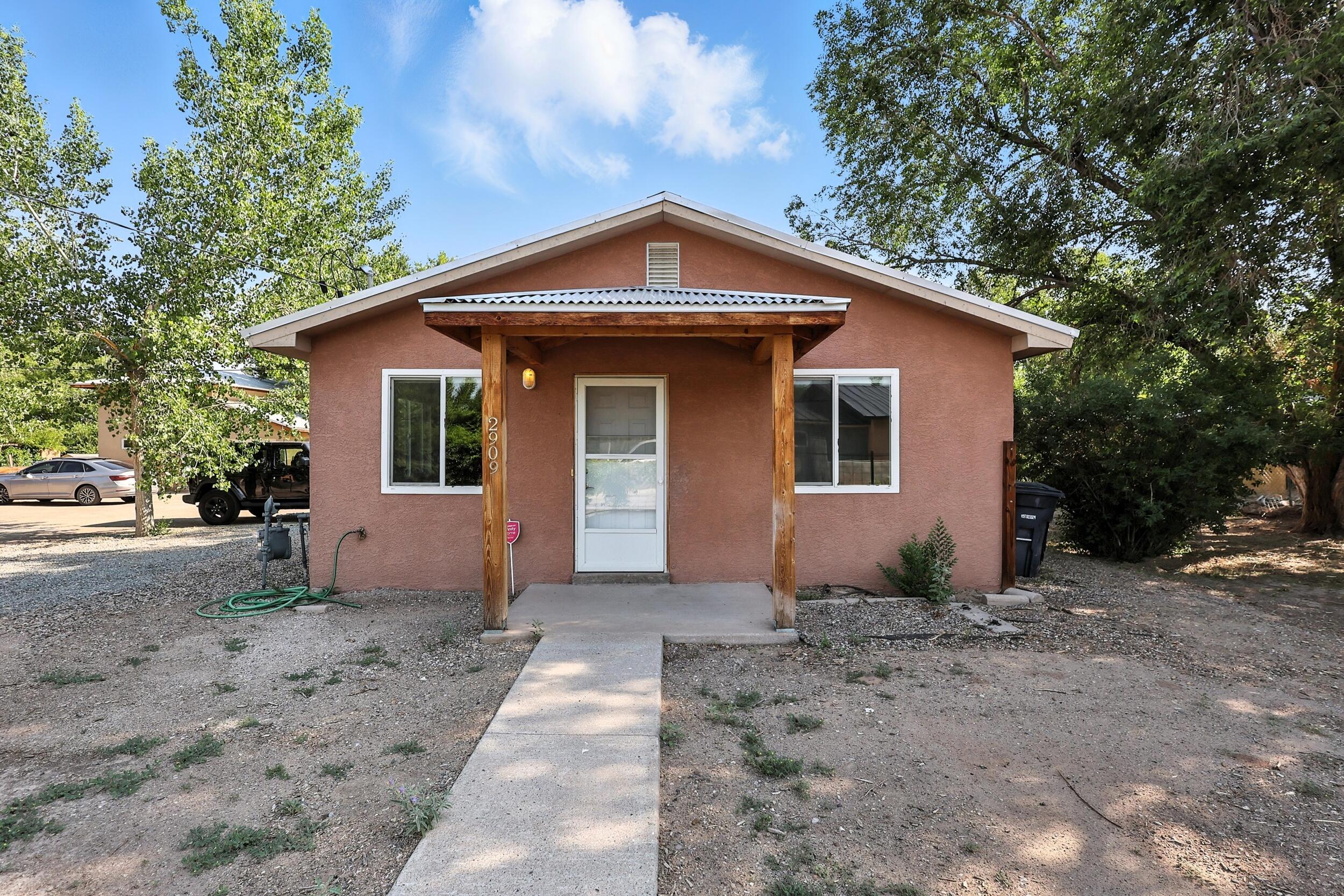 Hidden Gem Minutes from Old Town - Investment Property with Turn-Key Airbnb Casita. Welcome to this incredible opportunity tucked away in a quiet, desirable neighborhood just minutes from the charm and culture of Old Town Albuquerque. This unique property features a spacious 3-bedroom, 2-bath main home and a fully furnished, active Airbnb casita--ideal for investors, multi-generational living, or anyone looking to generate passive income.Main House Highlights: Primary suite with attached bath. Recently updated with new carpet, tile showers, and a new evaporative cooler. Open layout perfect for comfortable living or entertainingCasita Features: One-bedroom loft-style guest house with private entrance. Includes a 1-car garage. Currently a successful Airbnb rental--fully furnished