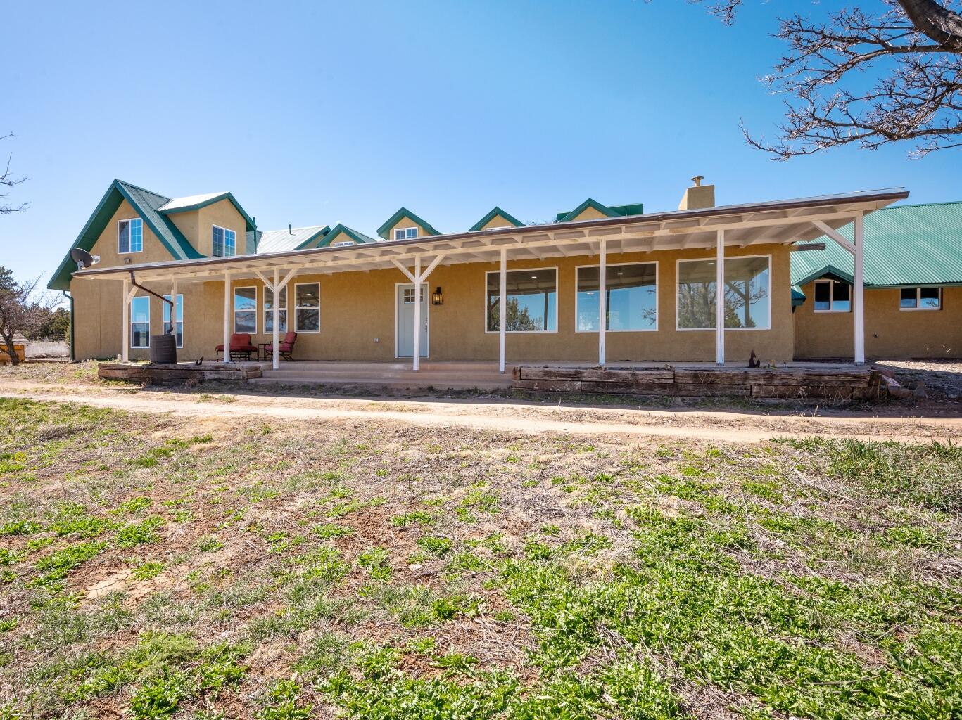 Spacious Living, Scenic Setting - A Sandia Park Gem Welcome to your own slice of paradise in Sandia Park! Set on over 3 acres, this beautifully updated two-story home offers room to roam both inside and out, featuring four generous bedrooms and three versatile living areas--ideal for family living, entertaining, or creating the perfect work-from-home setup. Nearly every inch of the home has been thoughtfully remodeled, blending modern comfort with timeless charm. Step outside to take in the majestic mountain views, or spend time in the fenced pasture with a stable--perfect for horses and awaiting your vision. Enjoy the serenity of country living just minutes from the conveniences of Cedar Crest and Sandia Park--restaurants, shopping, schools, and skiing are all nearby.