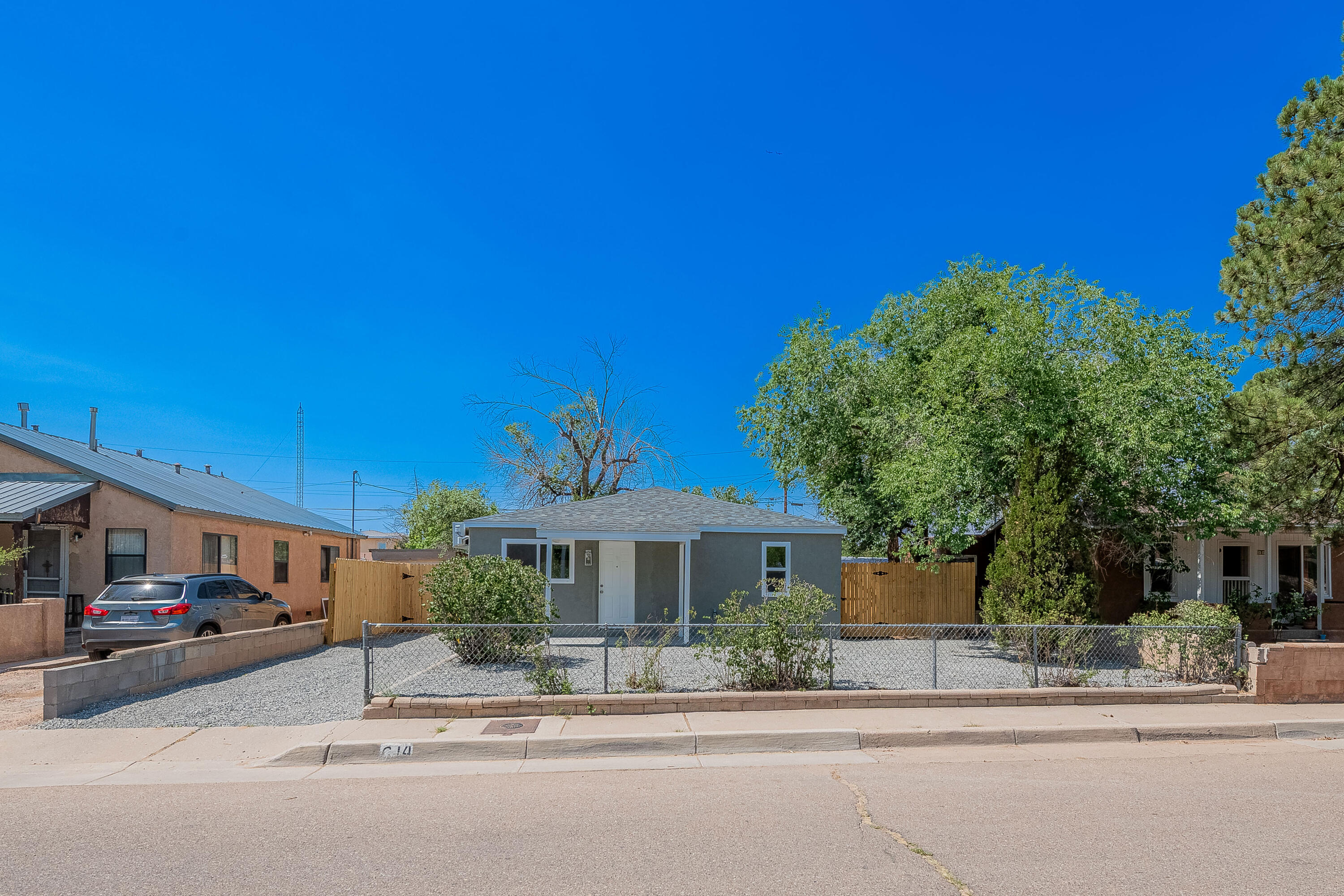 Discover this beautifully remodeled 3-bedroom, 2-bath home in Albuquerque's highly sought-after North Valley! With 1,058 sq ft of stylish living space, this home features a brand-new 30-year shingle roof, new synthetic stucco, new windows, fresh paint, and new laminate flooring throughout. Enjoy top-of-the-line all-wood cabinets with dovetail joints, stunning granite countertops, and all-new fixtures. Both bathrooms feature tiled showers, and each room has its own refrigerated mini-split unit for year-round comfort. Located at 614 San Lorenzo NW, this move-in ready gem offers quality, comfort, and modern elegance in a prime location!