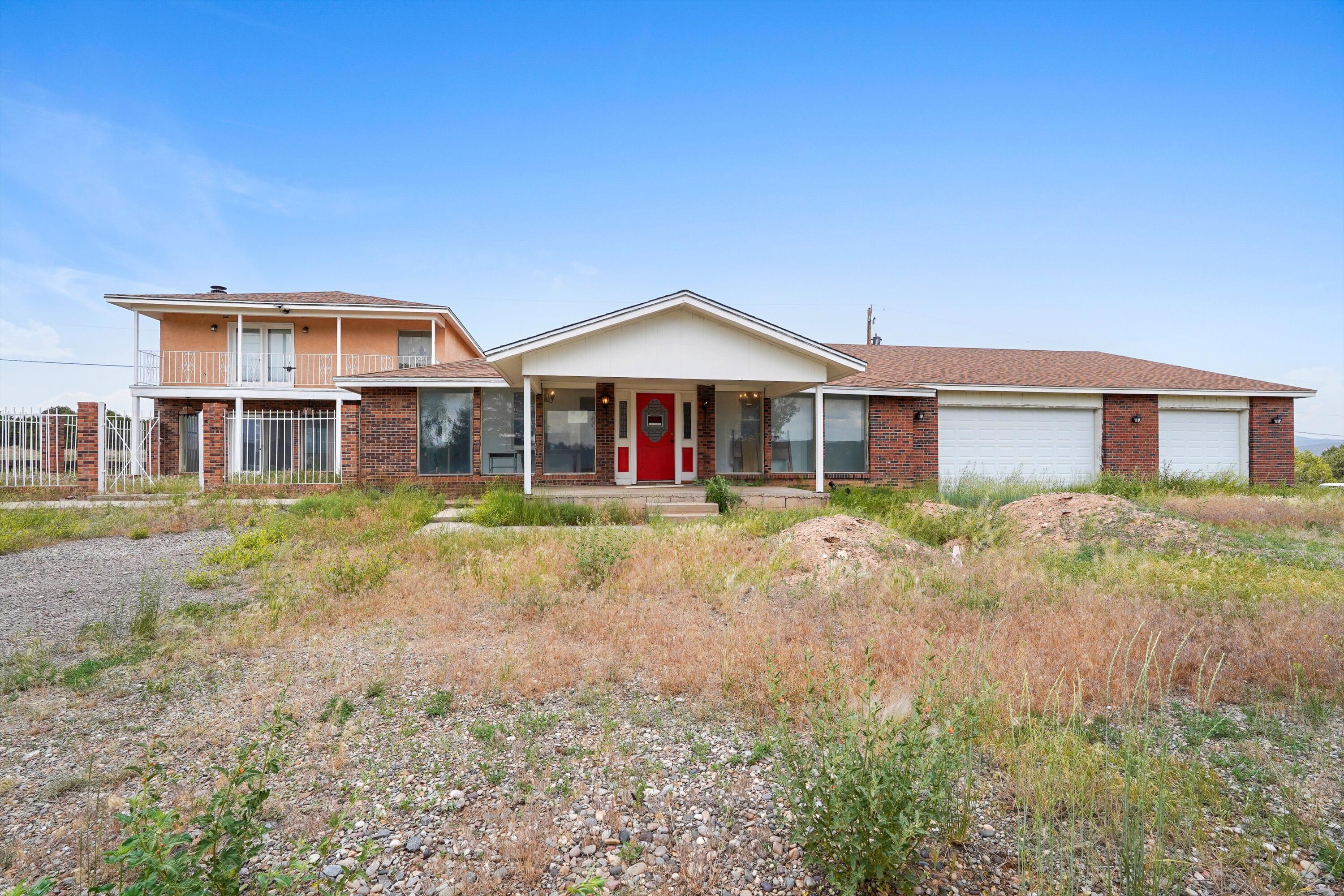 A RARE FIXER-UPPER OPPORTUNITY IN THE HEART OF THE EAST MOUNTAINS. This over 4,000 sf home in Tijeras offers the freedom to reimagine mountain living--four bedrooms, four full baths, a custom fireplace, walk-in closets, and a private upstairs primary suite with its own balcony. The bones are there, the layout expansive, and the setting unmatched. Nestled in the pines with wildlife at your doorstep and Albuquerque just a short drive away, you'll enjoy the best of rural peace and city access. This is your blank slate in a close-knit mountain community. Come transform this home into something truly your own.