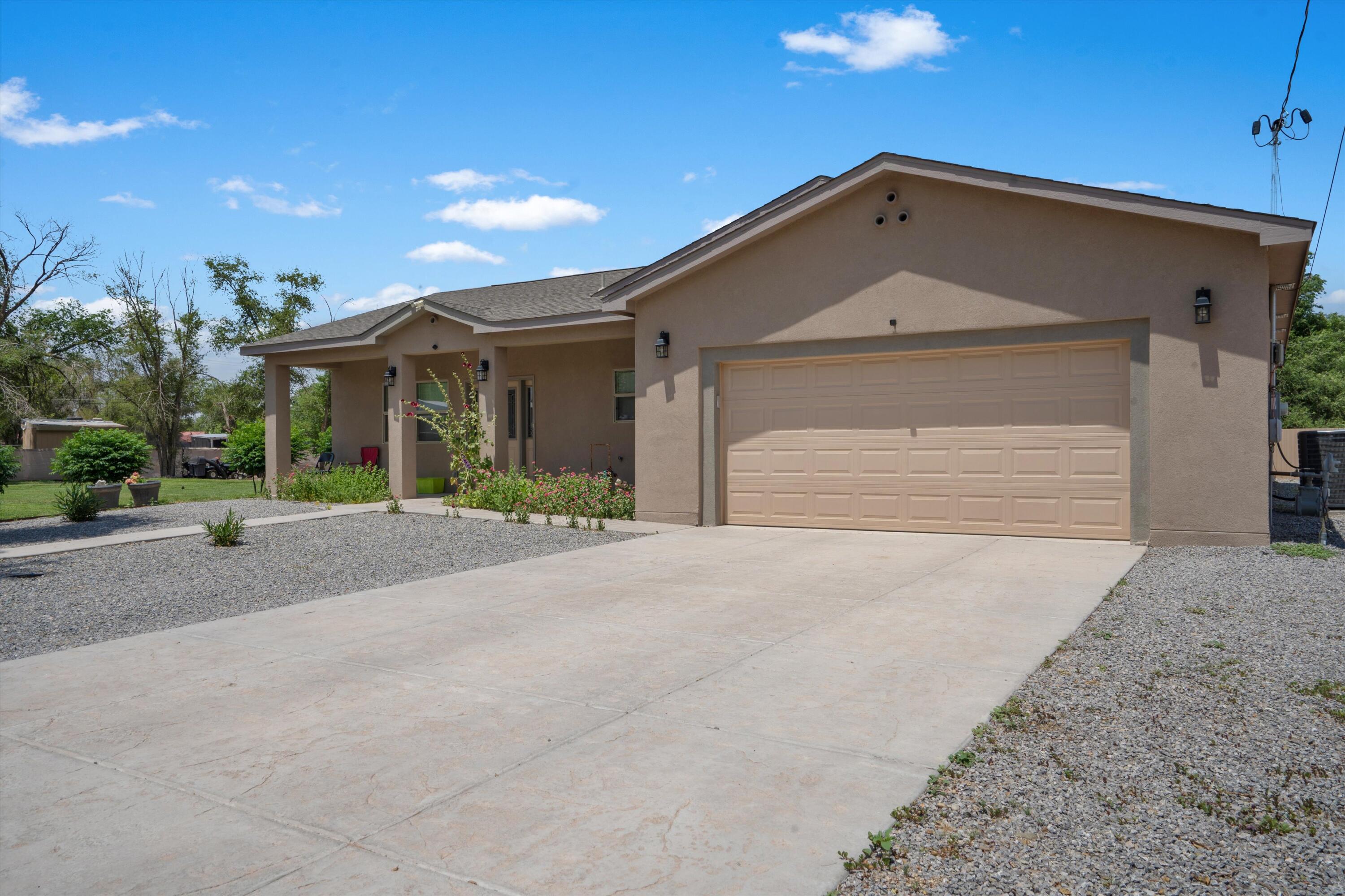 Built just 3 years ago, this brand new and beautifully maintained 3-bedroom, 2-bath home offers the perfect blend of modern comfort and serene living. Situated on a fully fenced 1-acre lot with mature trees and low-maintenance landscaping, the property provides both privacy and charm. Inside, enjoy a spacious open layout with an open, large and bright kitchen with an island, featuring sleek stainless steel appliances, soft gray cabinetry, and tile flooring  The home also features an oversized garage, a tankless water heater for energy efficiency and a 2x6 construction throughout the home. Whether you're relaxing on the front porch or entertaining in the heart of the home, this move-in ready gem checks all the boxes!