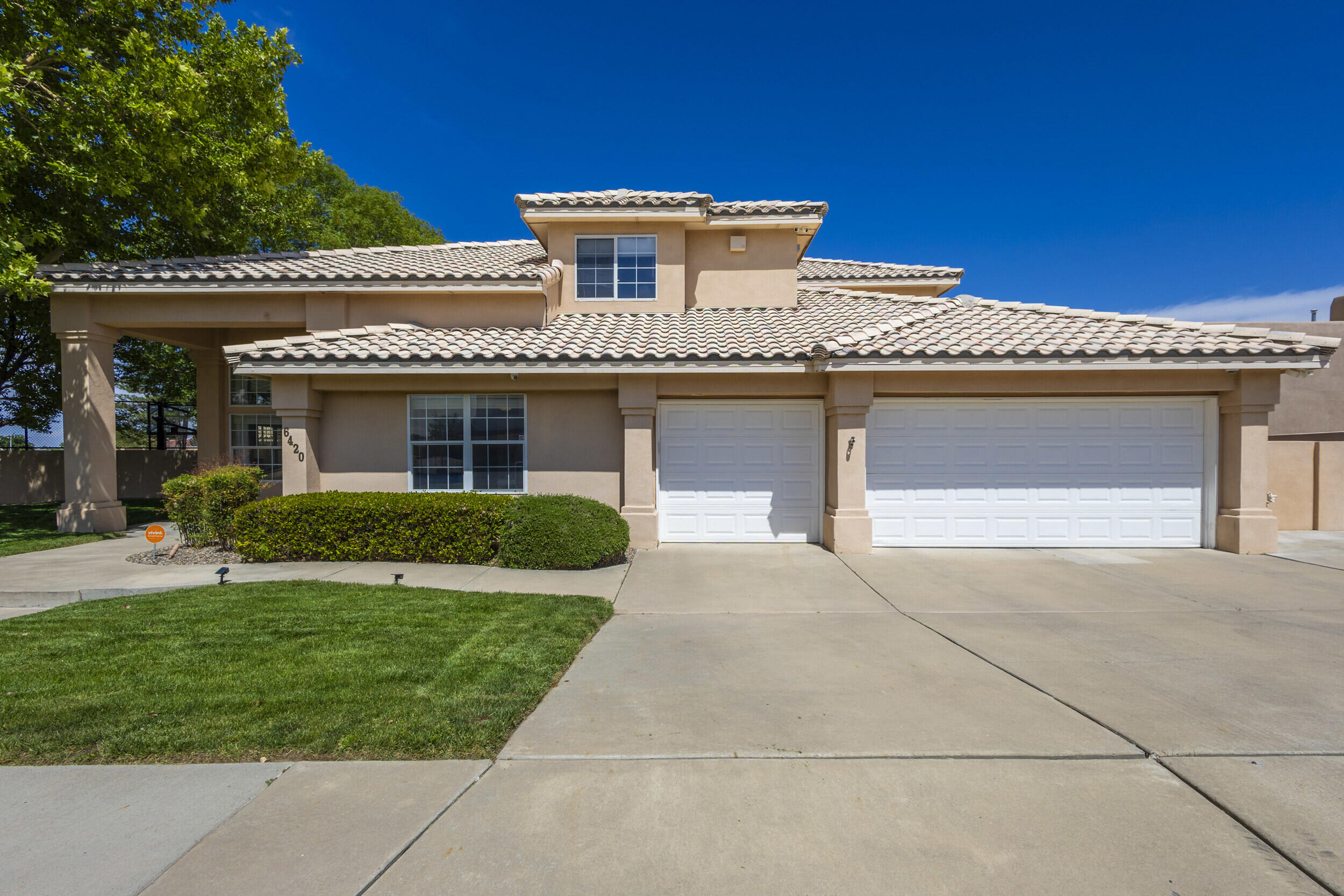 Welcome to this meticulously maintained 4,065 sq ft custom built Mechenbier home, where quality craftsmanship meets ultimate outdoor living. Located in one of Albuquerque, NM, this 4 bedroom, 3 bathroom home offers spacious elegance & thoughtful design.Step outside into a private backyard paradise, lush green grass sets the stage for endless fun with a full-size pickleball & basketball court, a built-in trampoline, and a charming playground set. Whether entertaining or enjoying quiet family evenings, this outdoor space is truly unmatched.Inside, the home features generous living areas, abundant natural light, & timeless finishes that reflect Mechenbier's signature style. Pride of ownership is evident in every detail, making this a rare opportunity to own a move-in ready rarity.