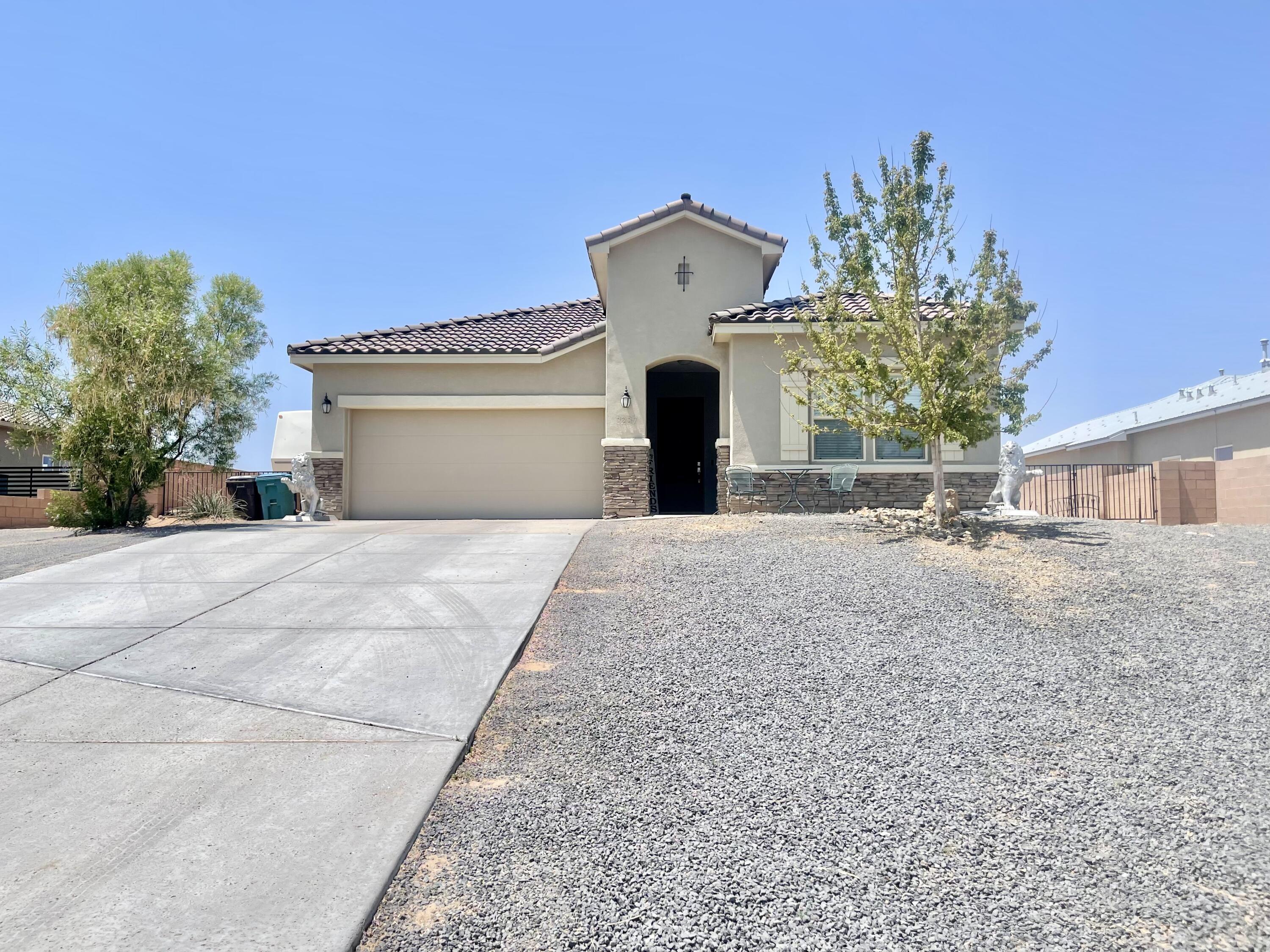 Discover the stunning Hakes Brothers home in the desirable Vista Entrada community. Step inside to an inviting open concept living area, enhanced by soaring ceilings and 8-foot doors that amplify the sense of space. The modern kitchen is a chef's dream, featuring a built-in gas cooktop, elegant glass hood vent, and a stylish farm sink, all complemented by top-of-the-line appliances. This space flows effortlessly into the living area, making it ideal for entertaining. Expansive windows flood the home with abundant natural light. Relax in the spacious primary bedroom and indulge in the luxurious primary bath, complete with double sinks, a separate tub, and a refreshing rain shower. A generously sized walk-in closet offers ample storage. The expansive backyard provides endless possibilities.