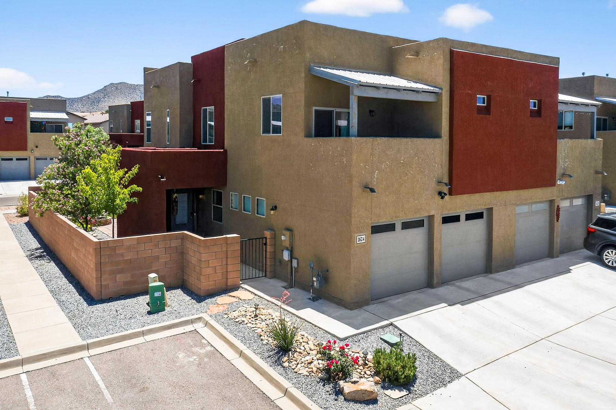 Move-in ready townhome shows like a model! Professional, low-maintenance landscaping w/ flower beds, drip system, turf, fire pit and seating, and solar lighting create a private outdoor oasis perfect for entertaining. Inside boasts granite counters, updated fixtures, SS appliances (all incl.), under-cabinet lighting, tile backsplash, & custom sink/vanity in the 1/2 bath. Smart home devices like MyQ, Yale, Ring, and Google Nest add convenience. Storage racks and shelving in garage and under stairs. Enjoy Sandia views from the LR! Upstairs offers a split floorplan w/ private primary suite featuring a large bath & walk-in closet. Each bedroom has upgraded custom closets. Laundry is stacked--W/D stay! You'll love this turnkey home. Near KAFB & Sandia Labs. Note: Occupancy available on 9-18-2025.