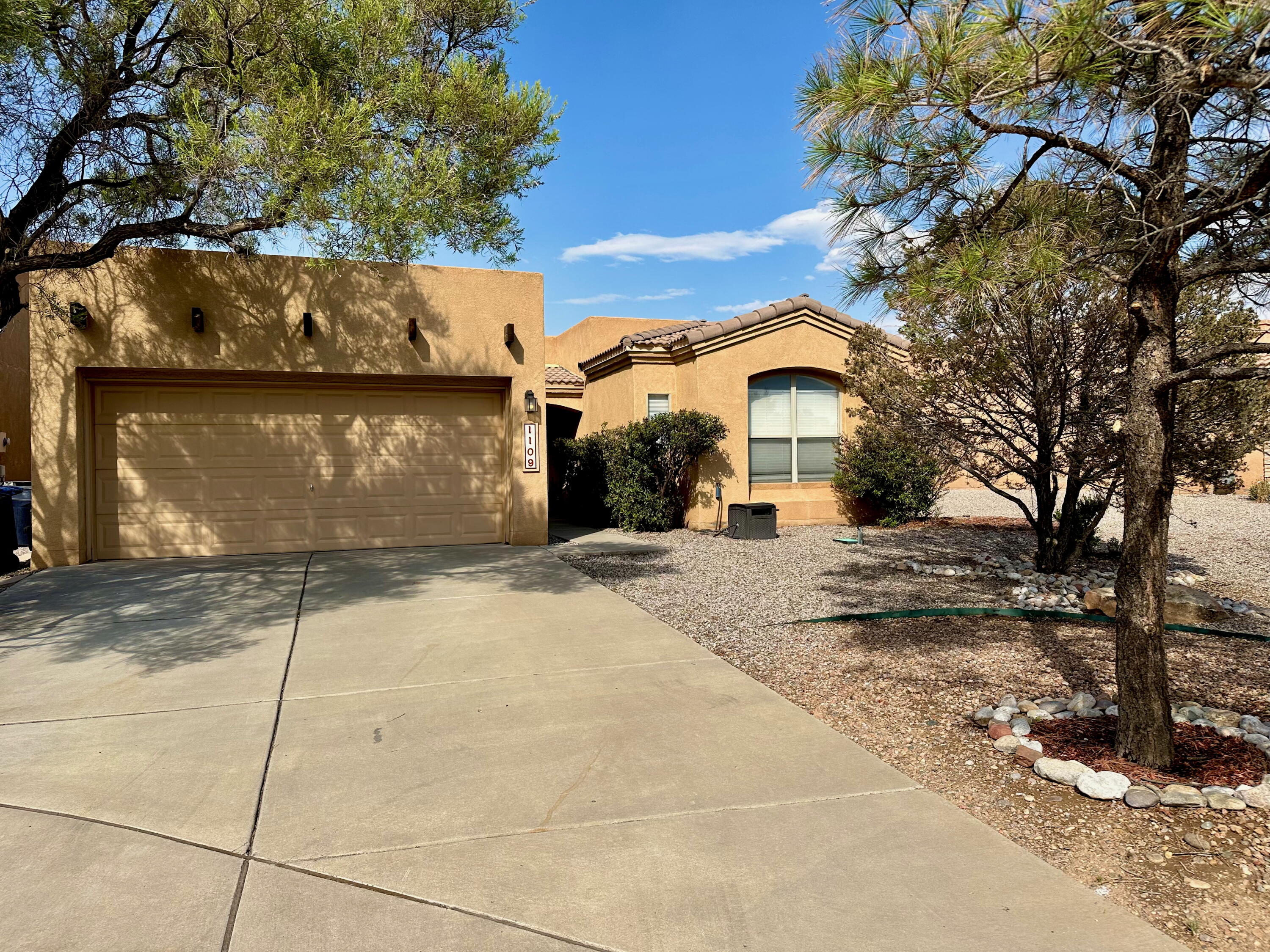 Located in the desirable Vista Del Norte subdivision, this charming 3-bedroom, 2-bath home offers an open floor plan with tile flooring throughout and carpet in the bedrooms only. Nestled on a partial cul-de-sac, the property features a spacious backyard with partial views of the Sandia Mountains--perfect for relaxing or entertaining on the open paved patio. Enjoy nearby parks, paved walking and biking paths, and close proximity to Balloon Fiesta Park. Convenient access to restaurants, shops, a soccer and volleyball complexes makes this home ideal for an active lifestyle. Don't miss out on this fantastic opportunity!
