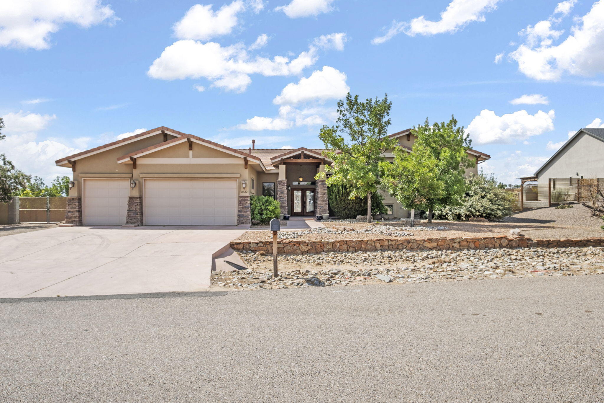 Luxurious Living at an Unbeatable Value -- Rio Rancho's Premier Custom Estate Awaits! Experience the height of elegance and comfort in this exquisite custom-built estate set on a coveted 1 acre corner lot with breathtaking views of the Sandia Mountains. With over 3,800 sq ft of meticulously designed living space, this exceptional 4-bedroom, 2.5-bath residence delivers sophistication, style, and space for grand entertaining and serene living. From the moment you arrive, the stunning curb appeal and 3-car garage make a lasting impression. Inside, you'll find rich wood craftsmanship throughout -- with custom built-ins, bookcases, and crown molding -- adding timeless warmth and character. Private theater room! Spacious downstairs game room! Whole-home built-in audio system