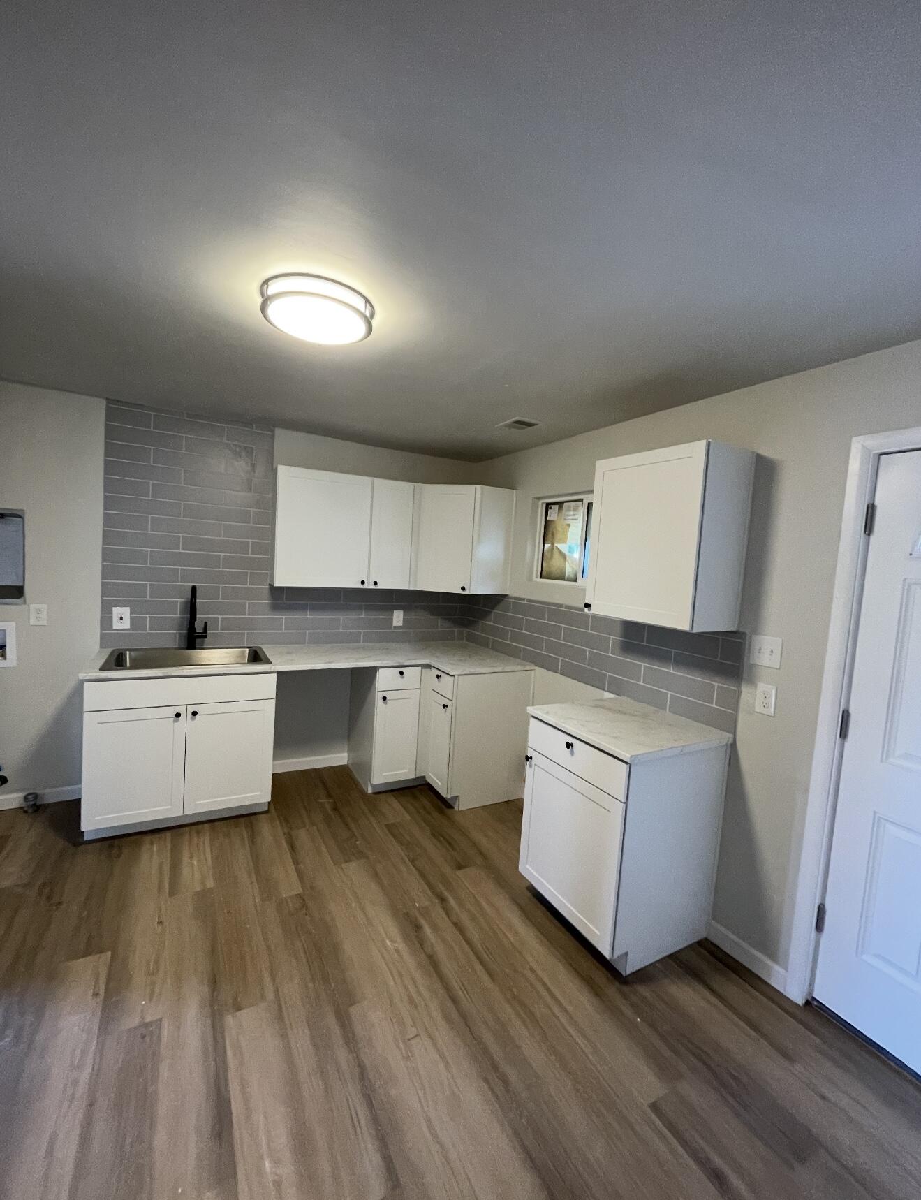 Recently updated 3 bedroom, 1 full bath single story home. This property features 2 living areas, updated kitchen and bathroom, along with a spacious backyard. Newly installed vinyl plank flooring, windows, interior/exterior paint.