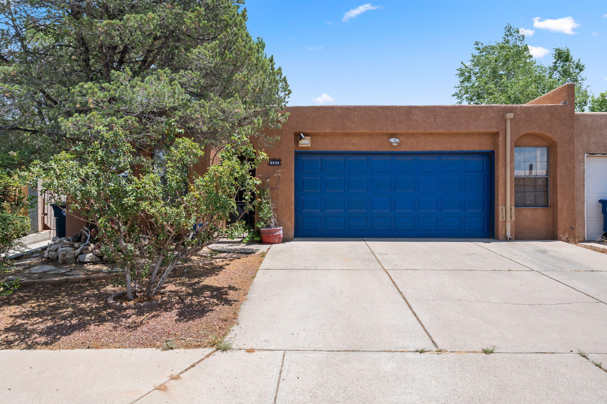 Welcome to this 3 bed, 2 bath single story townhome in the highly sought-after Academy West neighborhood, just moments from Arroyo Del Oso Golf Course--with no HOA! Featuring a spacious living area w/ a fireplace and wet bar, great layout, & a low maintenance back yard. Enjoy brand-new kitchen countertops. No carpet, tile throughout! Ideally situated near premier shopping, dining, and recreation, with quick access to I-25 and just 16 minutes to the airport.