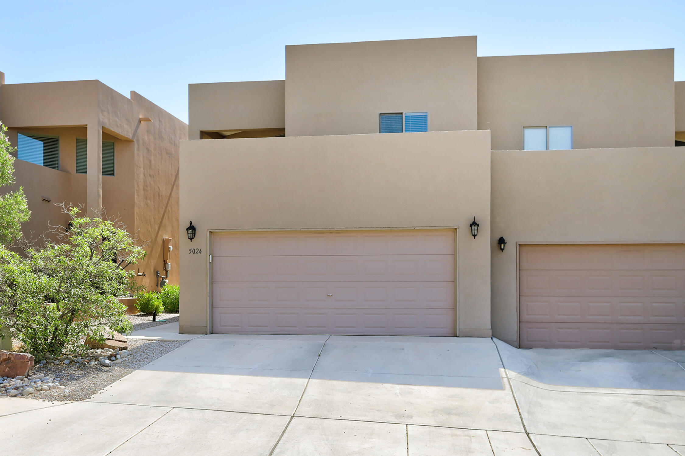 This bright three-bedroom townhome has the space and function you are looking for. You enter the home you are greeted by a bright large entryway with custom vinyl flooring throughout. The open living room connected to the dining room and kitchen gives ample space to relax and entertain. Up stairs you will find three bedrooms including the primary bedroom. The large primary bedroom offers great views and has an ensuite bathroom complete with a custom shower and a large walk-in closet you don't often find in a town home. Two additional bedroom and a full bath give the home fantastic separation between living areas and bedroom. Finally, the home offers a large east-facing private backyard with a pergola that would make it great for enjoying Albuquerque's evenings.
