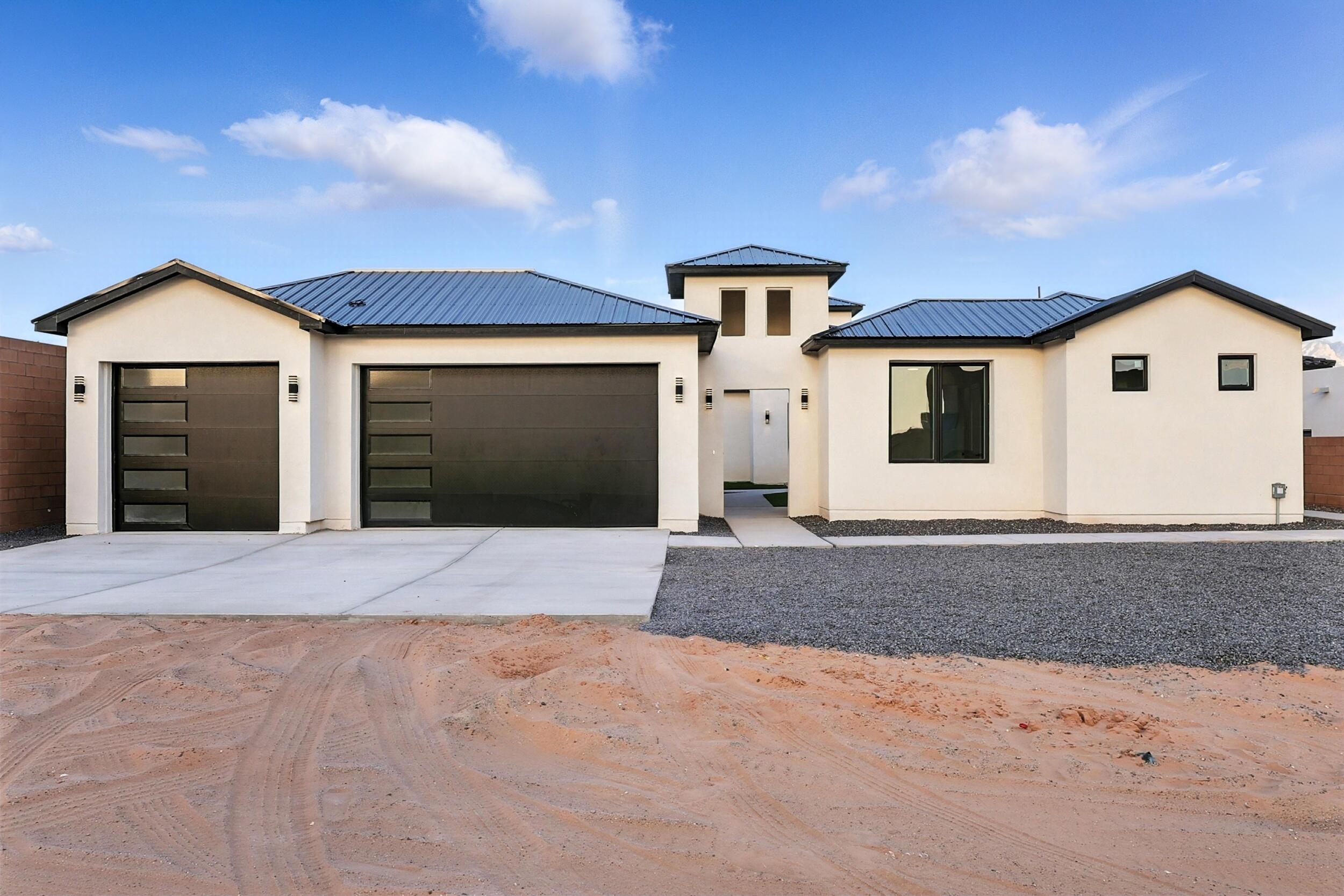 Discover refined elegance in this nearly 3,300 sq ft custom home 4-bedroom & 3 bath by Sunstone Estates.  Thoughtfully designed to showcase timeless craftsmanship, this residence features striking lighting and custom finishes that add a touch of grandeur throughout this contemporary home.  The open, airy layout flows seamlessly into outdoor spaces framed by premier landscaping and Sandia mountain views creating a perfect setting for both entertaining and serene living.  This home offers a rare blend of natural beauty and luxury.  Schedule your private showing today.