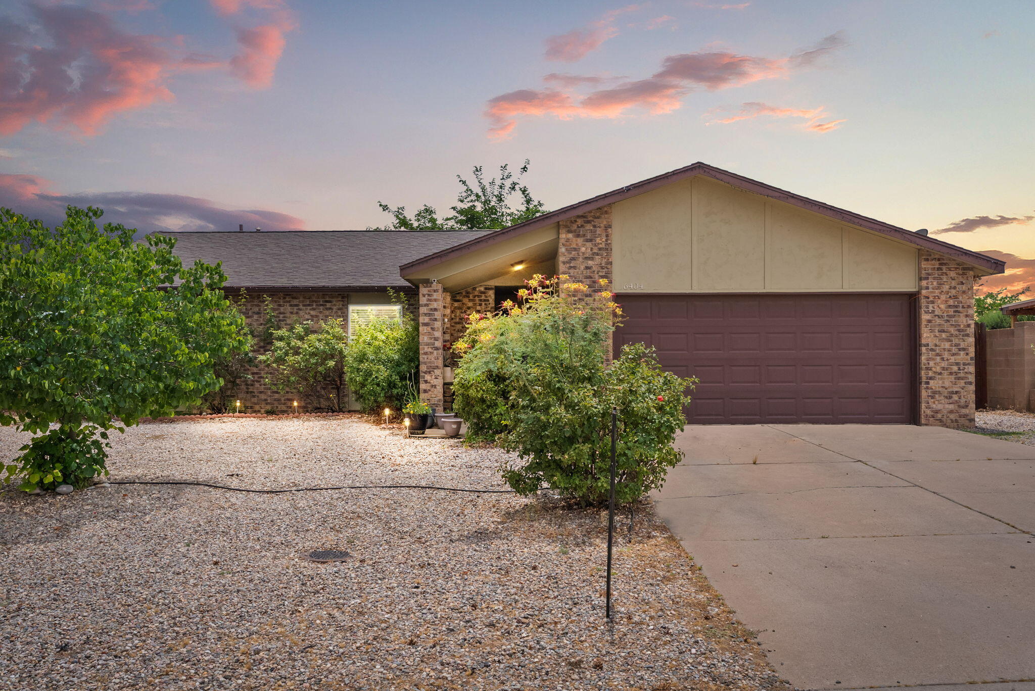 Tucked away on a quiet street, this well-cared-for home offers a comfortable and inviting layout with thoughtful updates throughout.  Short distance to the coveted Trailhead Park and river access. The spacious living area features a stunning custom stone fireplace with wood-burning warmth--perfect for cozy evenings at home. The kitchen is functional and bright, complete with a pantry and a generously sized dining area ideal for casual meals or entertaining. You'll find three spacious bedrooms, a large utility room, and the peace of mind that comes with no carpet and no polybutylene plumbing, and backyard access. Enjoy newer kitchen appliances and updated gutters, making this home truly move-in ready.