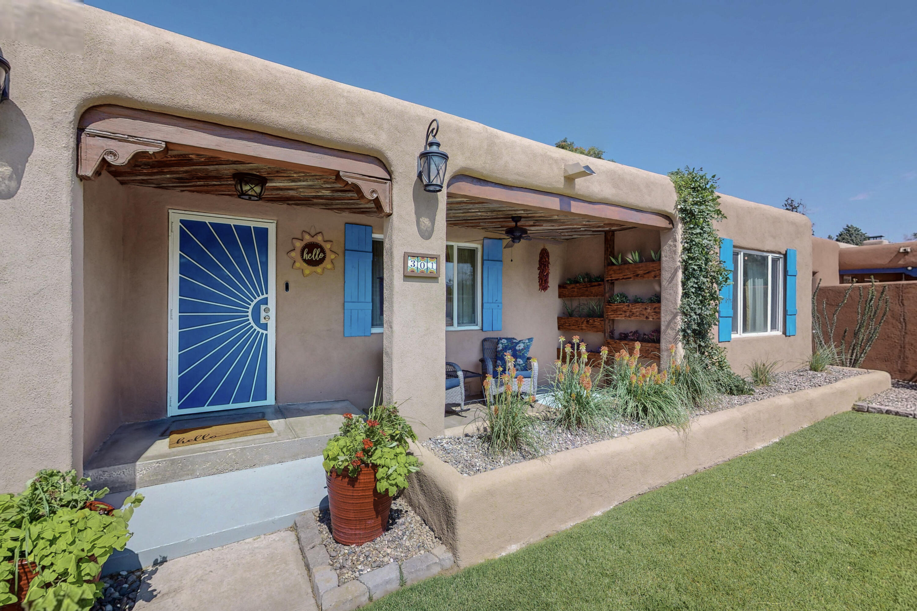 Look no further! From the moment you arrive at this 3 bed 2 bath smart home you'll be amazed. Lush green grass w/ SW plants and flowers. From the front porch you will notice the reclaimed wood faux shutters, wood ceiling and custom planters. Stepping into the LR with hardwood floors, cove ceilings and kiva fireplace. Updated kitchen with slate flooring, Custom built butcher block counter tops, custom cabinetry, SS under mounted sink and SS appliances. Primary bedroom with oversized roll in showed with pebble stone flooring. 2 additional bedrooms 1 with built in solid wood shelving and wood bed frame with more storage. Bonus office or 4th bedroom of the LR. Back yard oasis with wisteria covered pergola. HVAC, PEX plumbing.Sewer line replaced from home to city connection. water heater 2025
