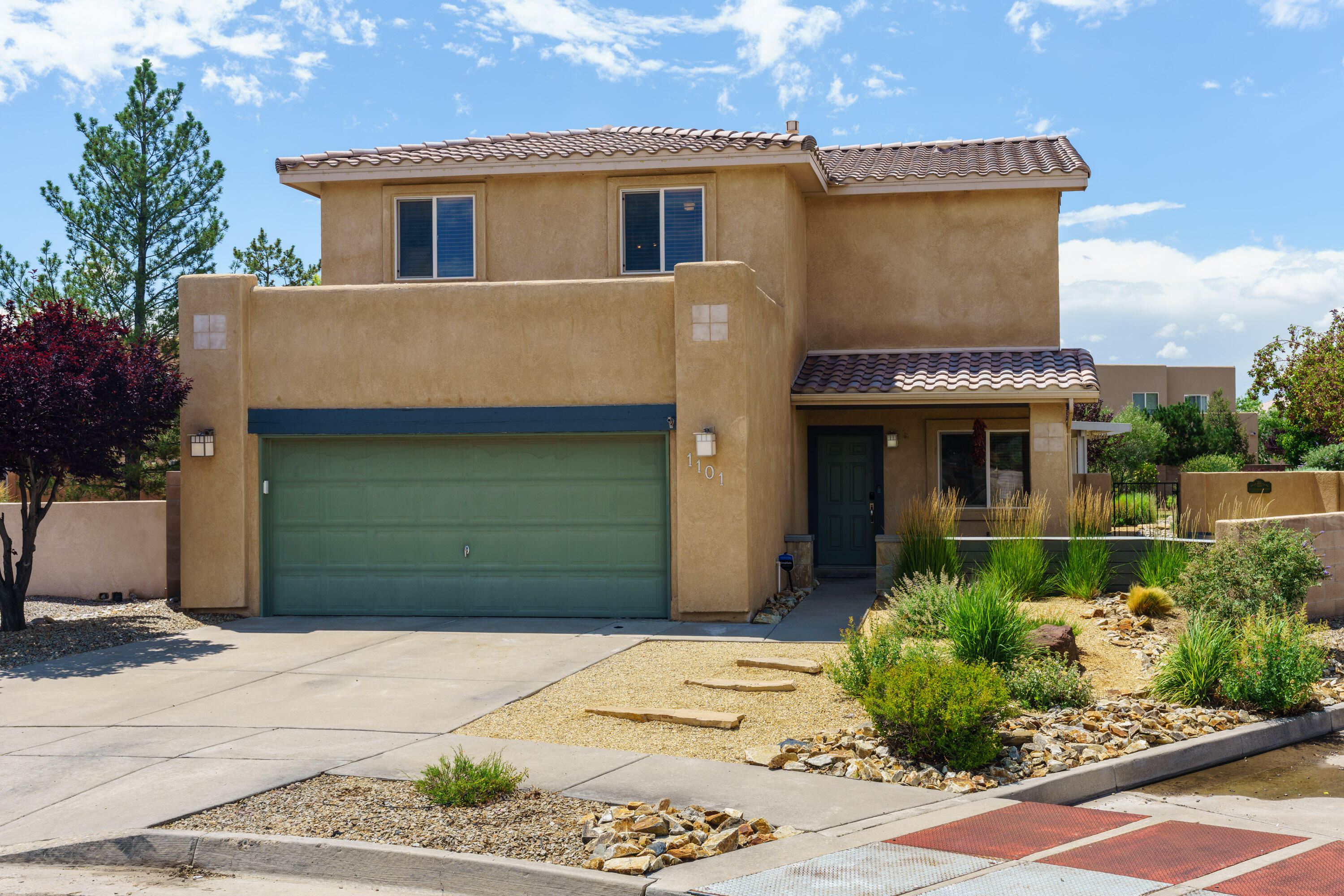 Welcome to a truly special 4 bedroom home in sought-after Vista Del Norte known for its parks, trails, and prime location for Balloon Fiesta views. Situated on a larger lot in the neighborhood, this property offers a lush backyard retreat with 16 trees, mature landscaping, and raised garden beds. Inside, enjoy the light-filled two-story great room, custom kiva fireplace, and updated kitchen. The primary suite is on the main level with direct patio access. Upstairs, find the remaining 3 bedrooms while taking in beautiful mountain views. Schedule your private showing today!