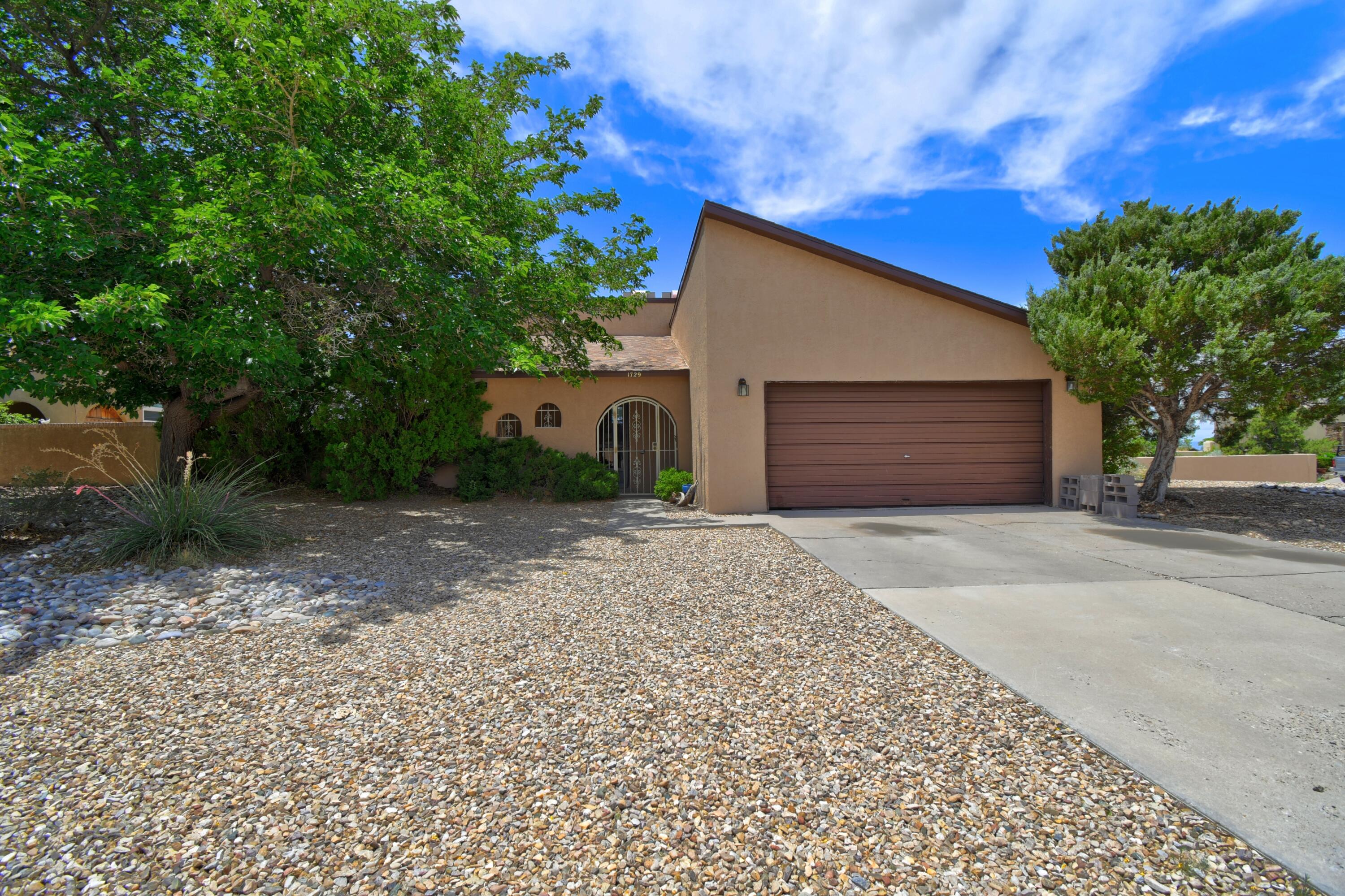 Nestled in the tranquil Foothills, this light-filled 3-bedroom, 3-bath home offers stunning views of the majestic Sandia Mountains. Thoughtfully designed with an open, airy layout, the home features a spacious kitchen/living area perfect for relaxing or entertaining. Wood burning fireplace adds charm. Primary is large and offers an inviting bath with soaking tub and walk in closet. Enjoy ABQ beautiful weather from your private pool on a generous corner lot that provides both space, privacy and beautiful views. Bring your imagination!