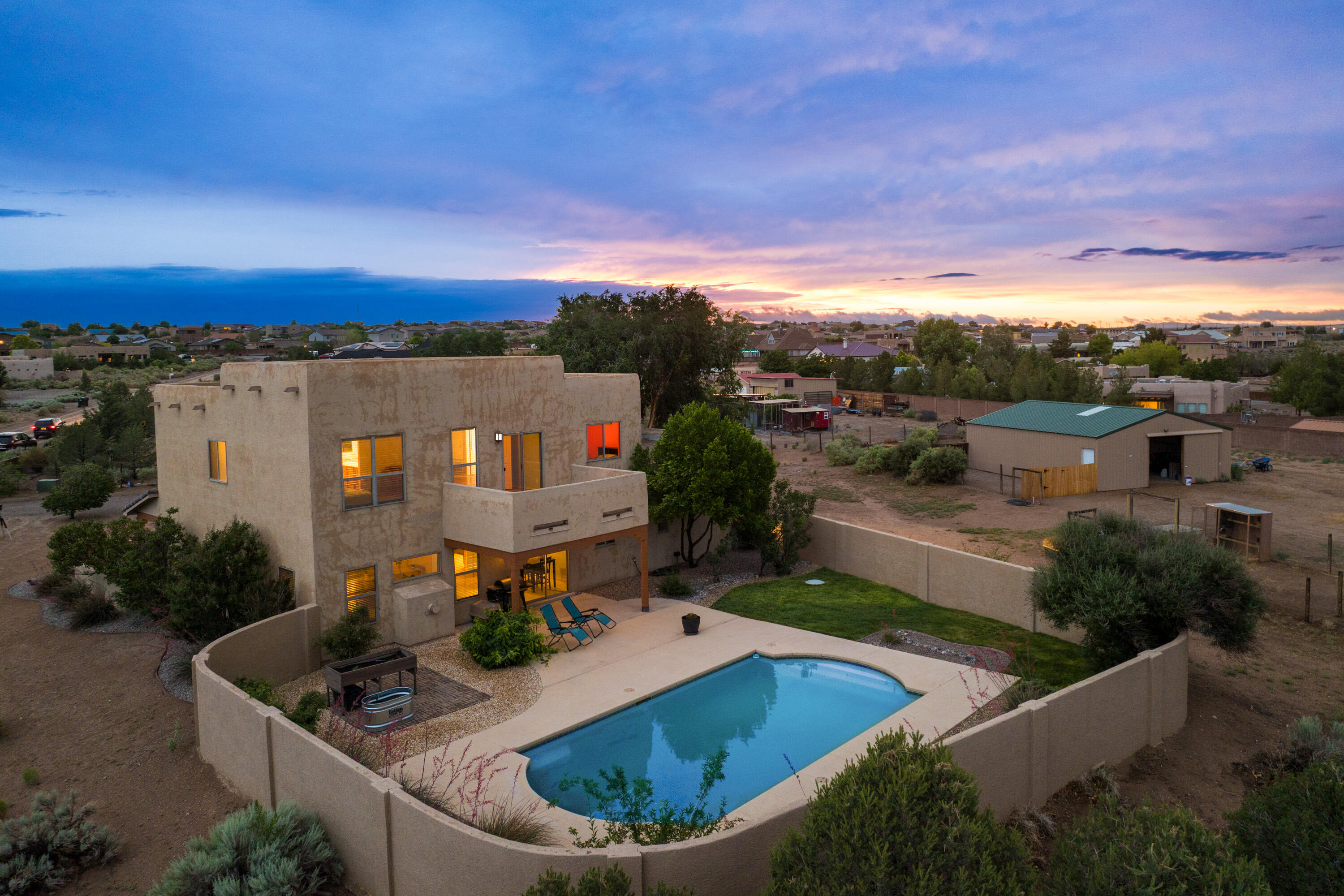Come home to your own peaceful oasis in Rio Rancho. This spacious 2-story home sits on 1 acre and offers 4 bedrooms plus an office (or 5th bedroom), 3 baths, a 3-car garage, barn, and private pool. Relax after a long day as soft light pours through the windows and the sunset paints the Sandia Mountains. There's room for your animals, your hobbies, and your dreams--with space to breathe and unwind. Whether you're floating in the pool, caring for your horses, or simply enjoying the quiet, this is the comfort and freedom of home.