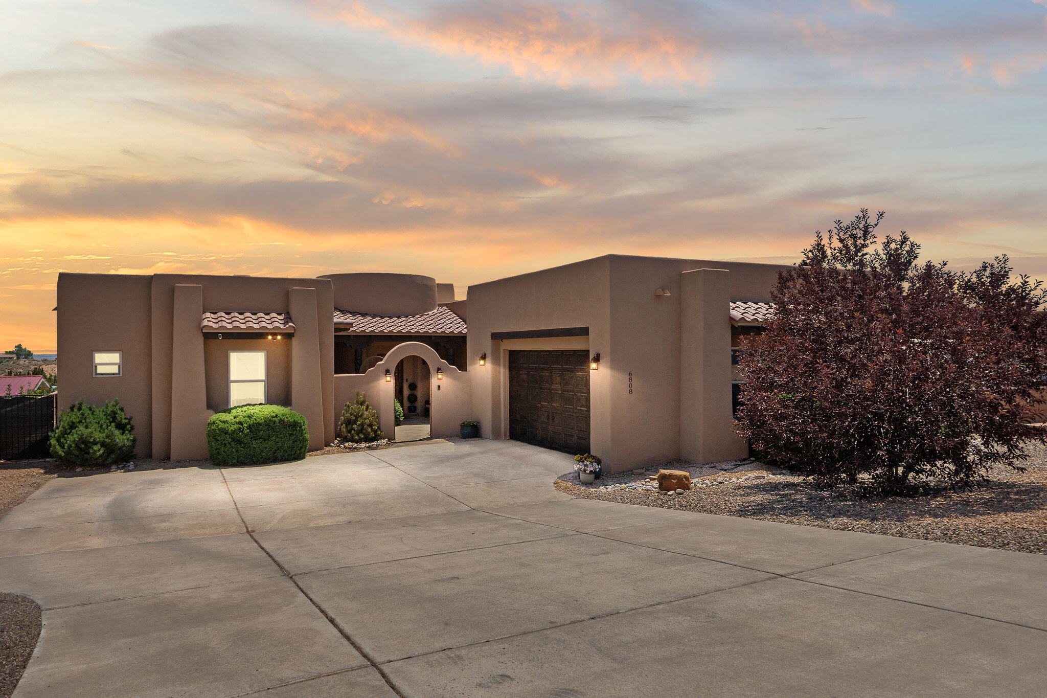 Enjoy unobstructed views of the Sandia Mountains in this custom single-story home on 0.5 acre lot.  The entry features a walled courtyard and fountain. The foyer leads to a beautiful great room with raised ceiings and a kiva fireplace.  The kitchen features an island with plentiful seating, a walk-in pantry, granite countertops, stainless steel appliances opening up to the dining room and great room, perfect for entertaining.  Large private master suite and master bath with garden tub, separate shower and walk-in closet  The home has radiant heat, solar,refrigerated air, den, office/sitting room, large laundry room with sink.  Relax and enjoy the stunning views from the back patio and landscaped yard. Basketball court in lower yard.  A wonderful place to call home!