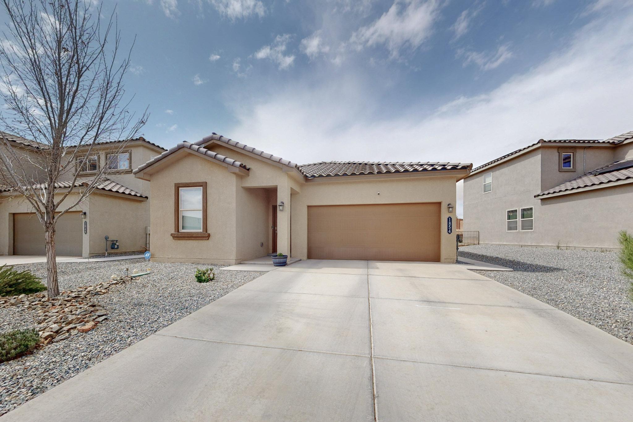 WHY PAY MORE FOR A NEW BUILD WHEN YOU CAN HAVE THIS HOME! Built in 2021, this home blends modern features with practical design in a welcoming space. The open floor plan provides natural light and easy movement, while the spacious kitchen offers ample counter space and a walk-in pantry for organization. The low-maintenance backyard includes fruit trees, herbs, and flowers, adding charm. Inside, enjoy two full bathrooms, a walk-in master closet, and an integrated smart home system--controlled via Wi-Fi and Z-wave. This home is just 2 minutes from Los Lunas High School, near shopping, dining, parks, and major employers, and offers quick access to Albuquerque. Offering a harmonious balance of comfort, style, and convenience, this home is an ideal place to start your next chapter