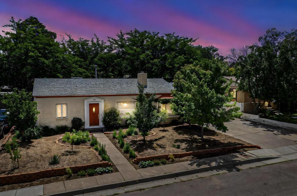 A Charming and Updated bungalow style home just a short stroll to Hyder Park and Nob Hill restaurants and shopping. Emotional Curb appeal and back yard! Light flows throughout the 3-4 bedroom, three bath home featuring hardwood floors, vintage built-ins, living room with gas burning fireplace, and second living/Possible 2nd Primary. Charming kitchen with custom white cabinetry and breakfast nook with bay window. Two sets of French doors lead to the beautiful private backyard offering mature gardens, patios, and separate area perfect for pets or play. Additional improvements include replaced sewer line and main water line, upgraded thermal windows, tiled utility/mudroom, front and rear yard irrigation systems, fruit trees, and abundant storage. Convenient commute to UNM, Sandia Labs & KAF